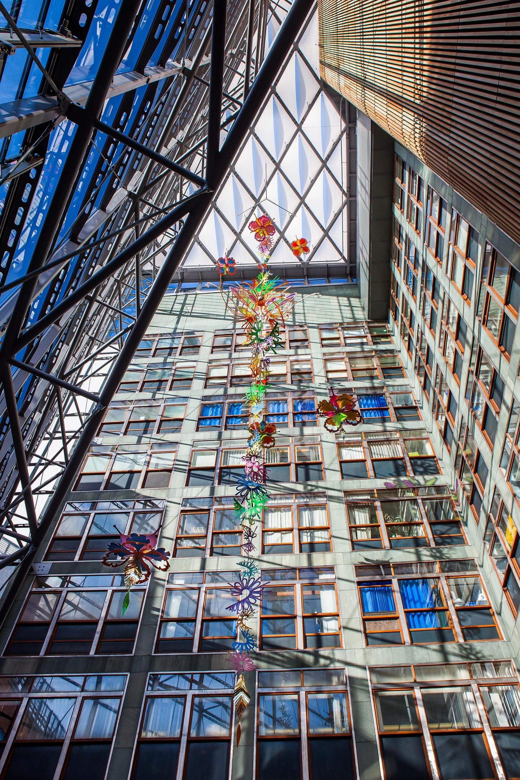 NHS hospital colorful permanent art therapy hanging flower sculpture installation atrium London