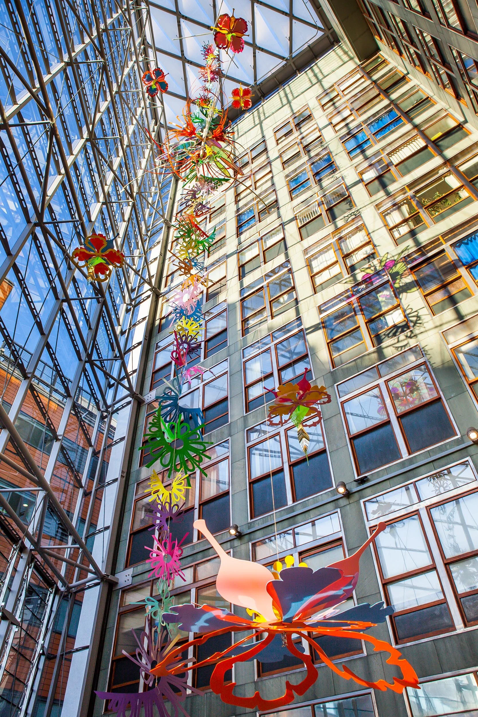 NHS hospital colorful permanent art therapy hanging flower sculpture installation atrium London