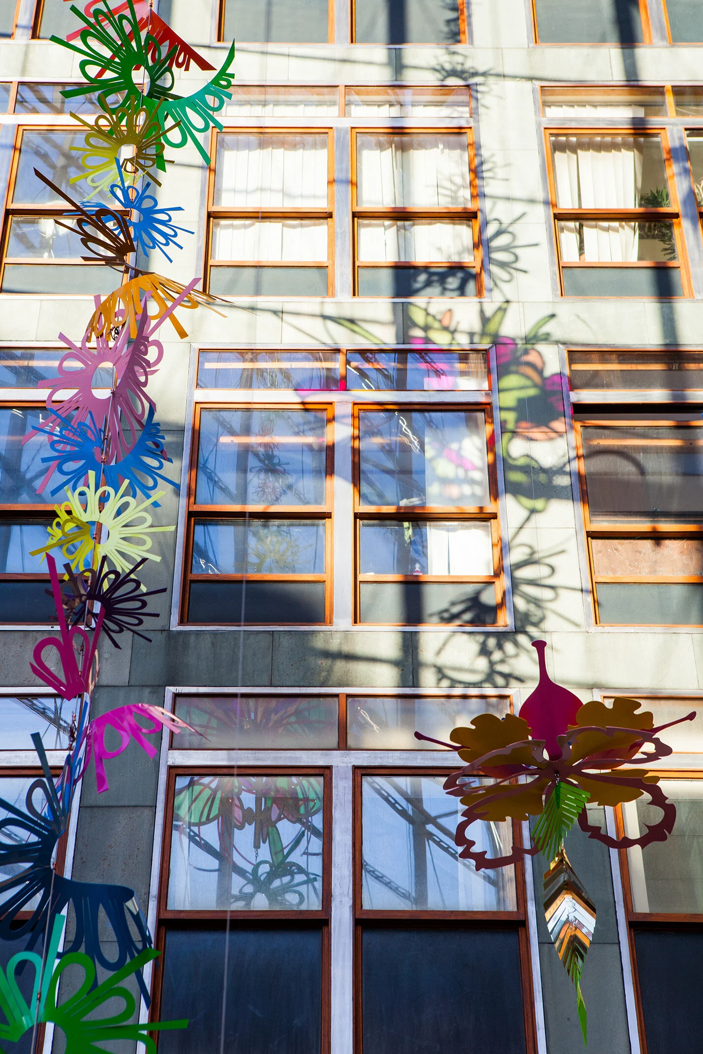 NHS hospital colorful permanent art therapy hanging flower sculpture installation atrium London
