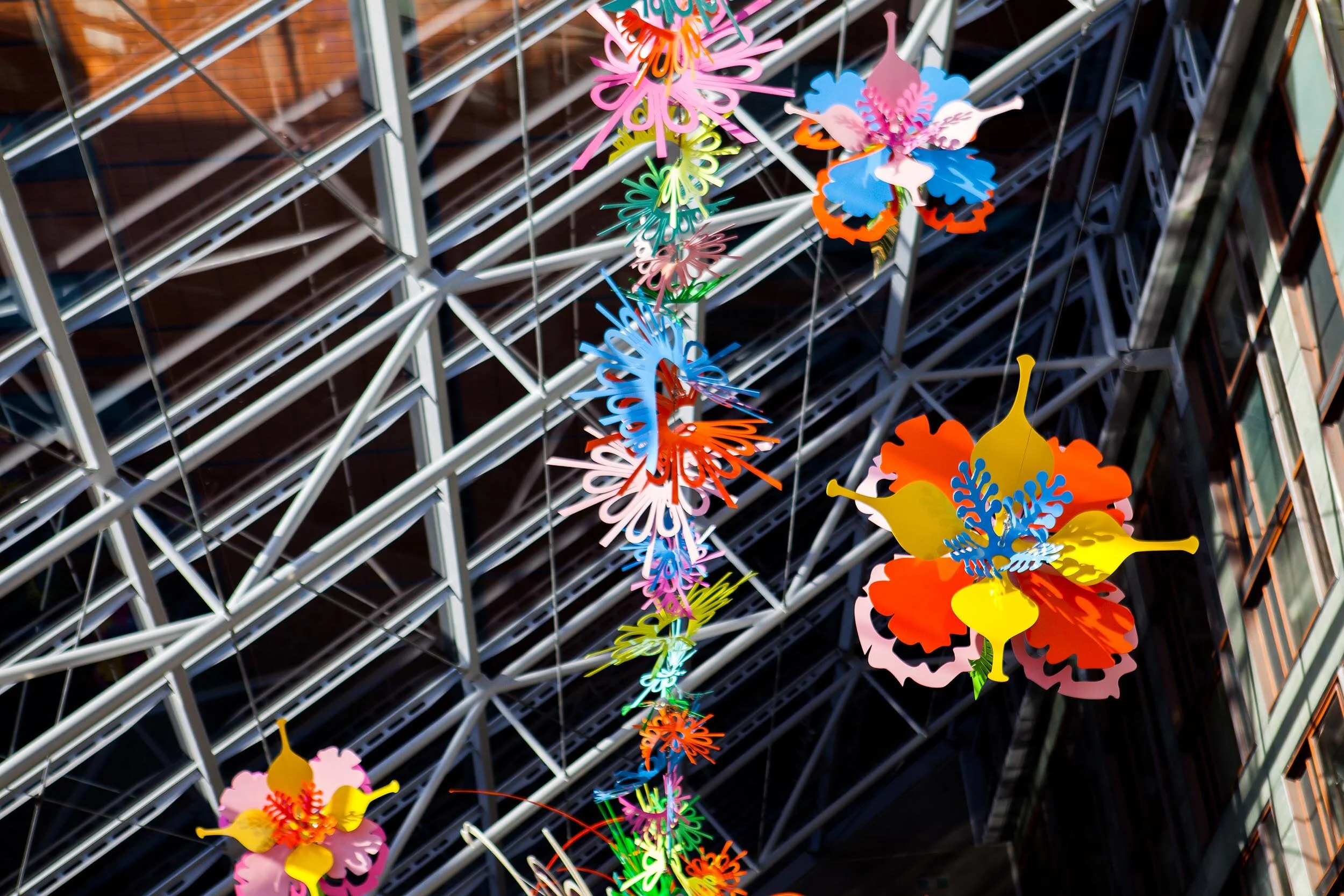 NHS hospital colorful permanent art therapy hanging flower sculpture installation atrium London