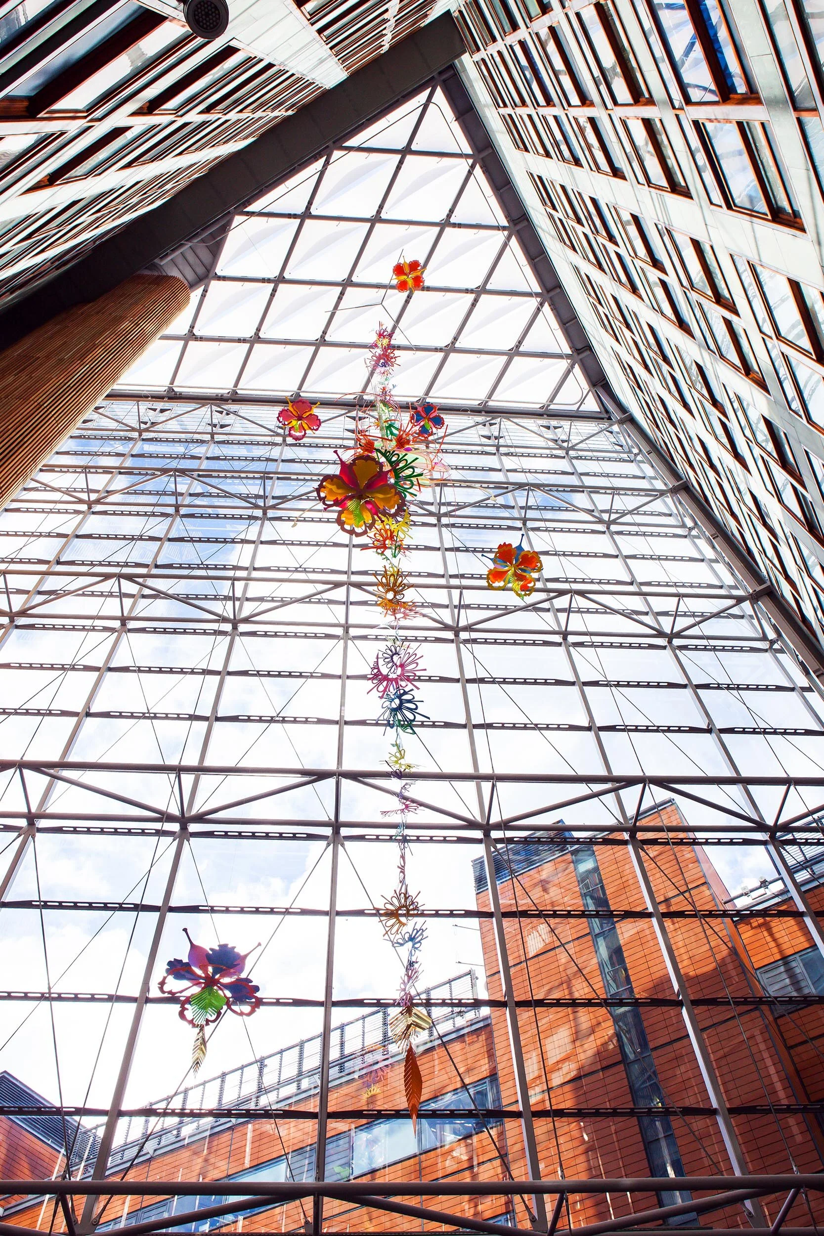 NHS hospital colorful permanent art therapy hanging flower sculpture installation atrium London