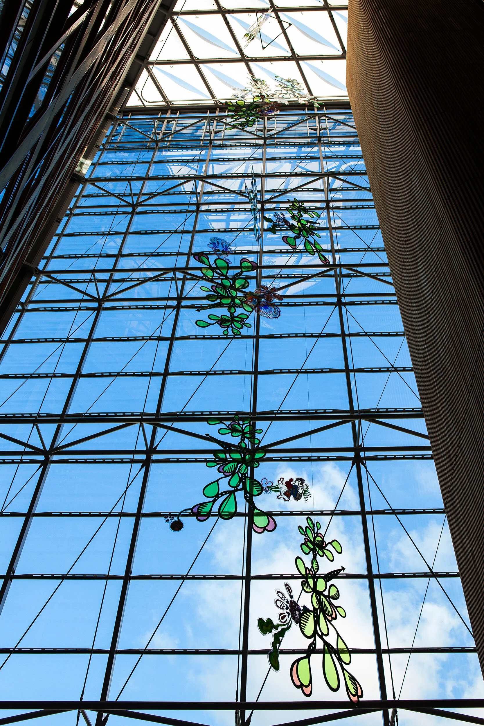 NHS hospital colorful permanent art therapy hanging flower sculpture installation atrium London