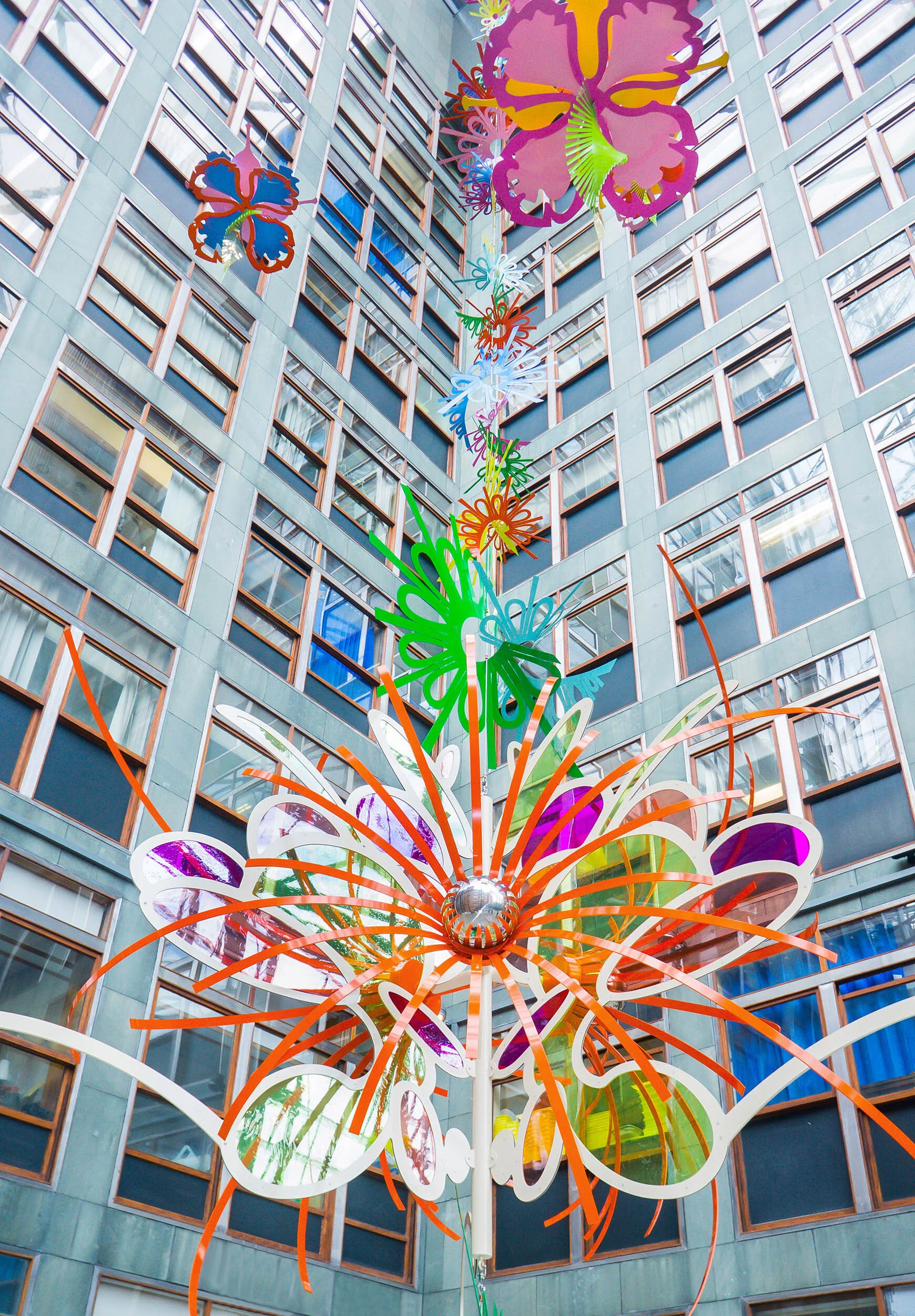 NHS hospital colorful permanent art therapy hanging flower sculpture installation atrium London