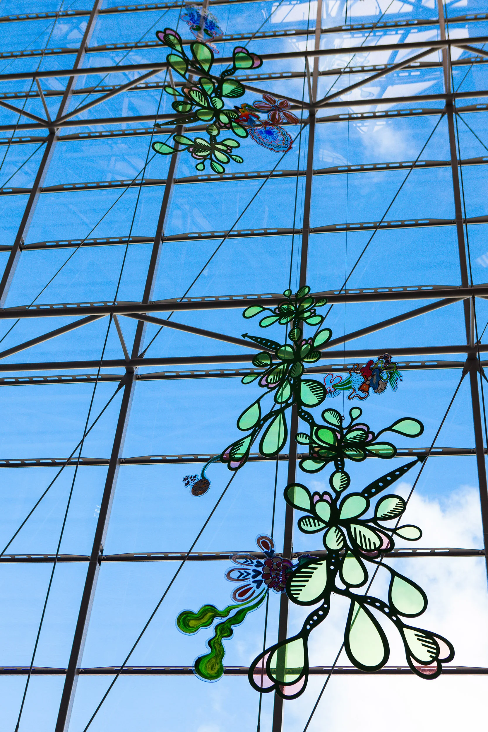 NHS hospital colorful permanent art therapy hanging flower sculpture installation atrium London