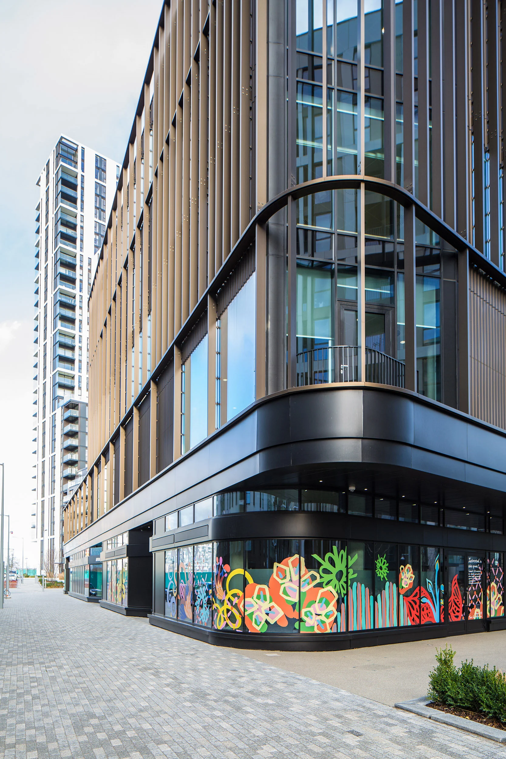 facade vinyl storefront display windows paintings art commission Greenwich Peninsula urban regeneration