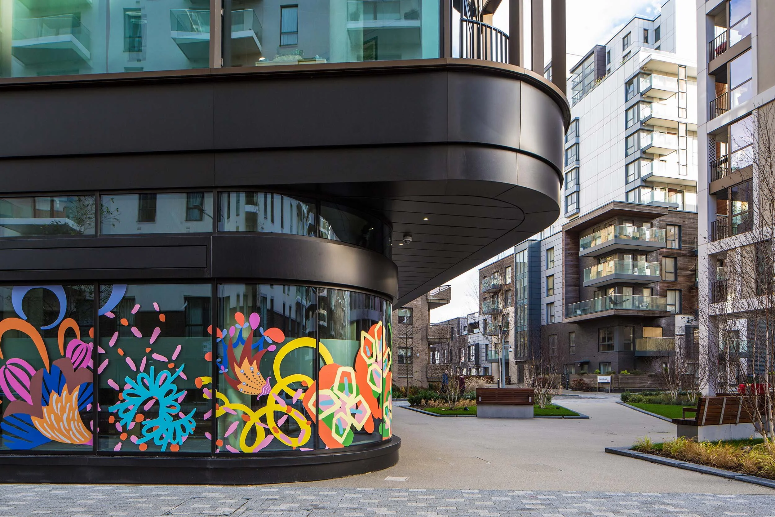 facade vinyl storefront display windows paintings art commission Greenwich Peninsula urban regeneration