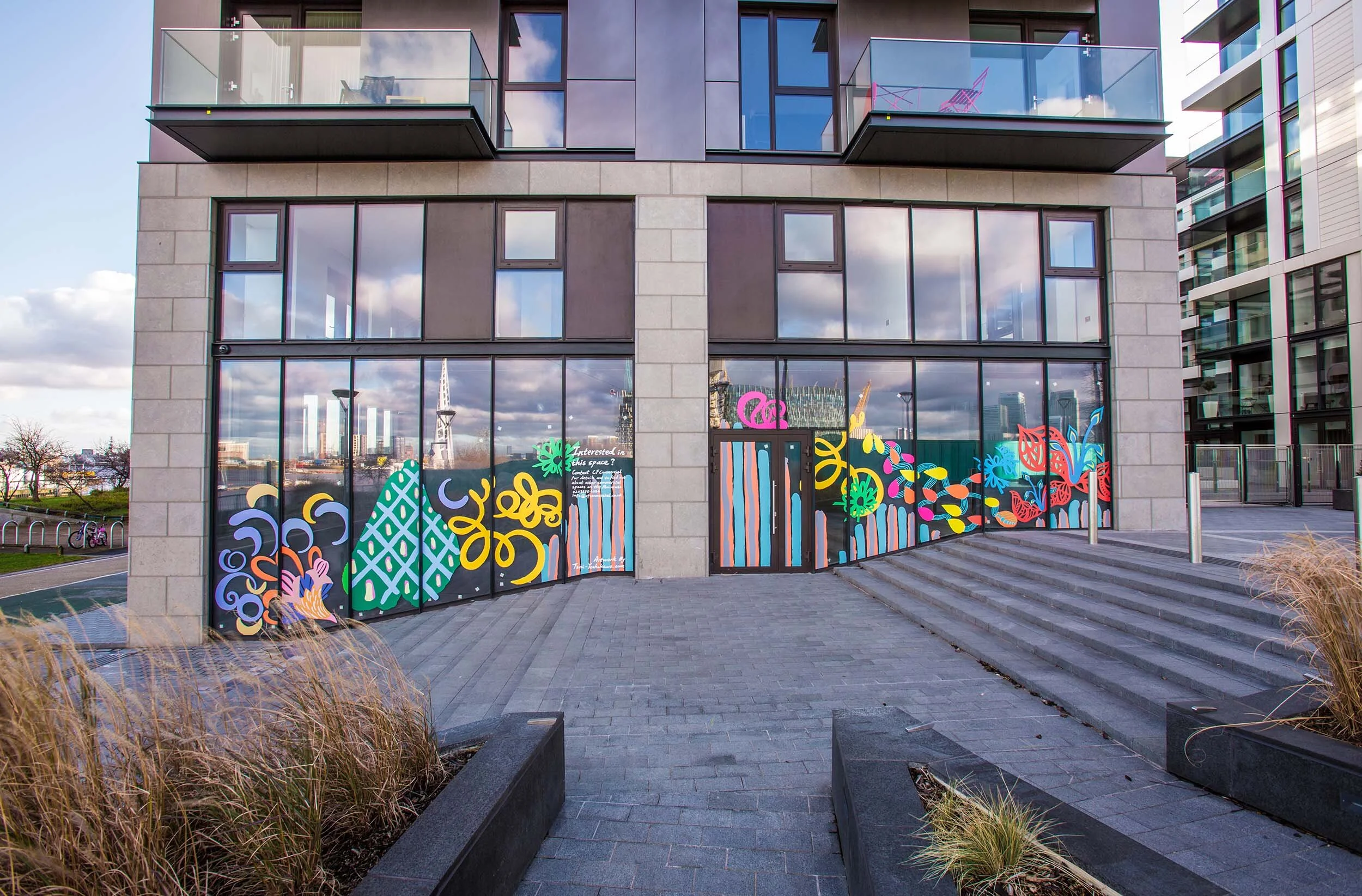facade vinyl storefront display windows paintings art commission Greenwich Peninsula urban regeneration
