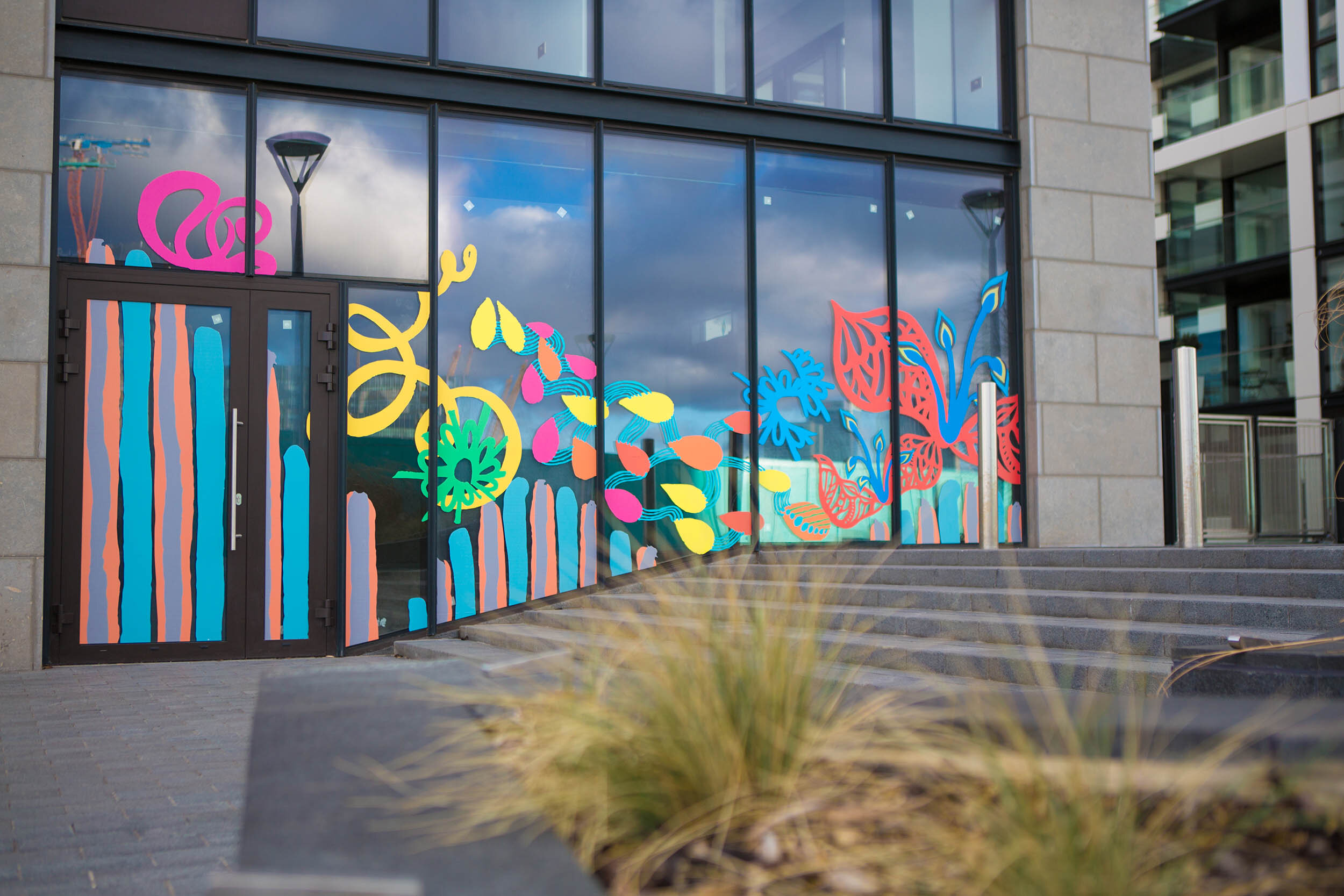 facade vinyl storefront display windows paintings art commission Greenwich Peninsula urban regeneration