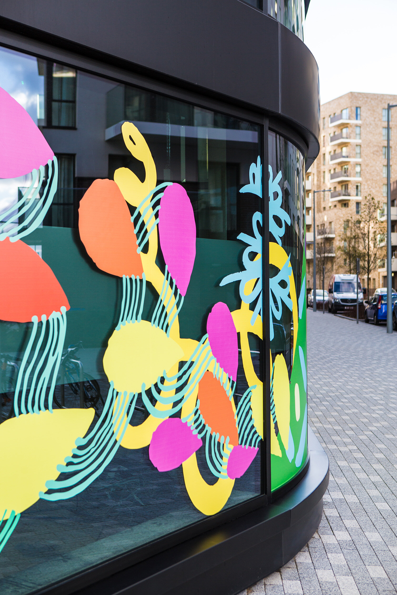 facade vinyl storefront display windows paintings art commission Greenwich Peninsula urban regeneration