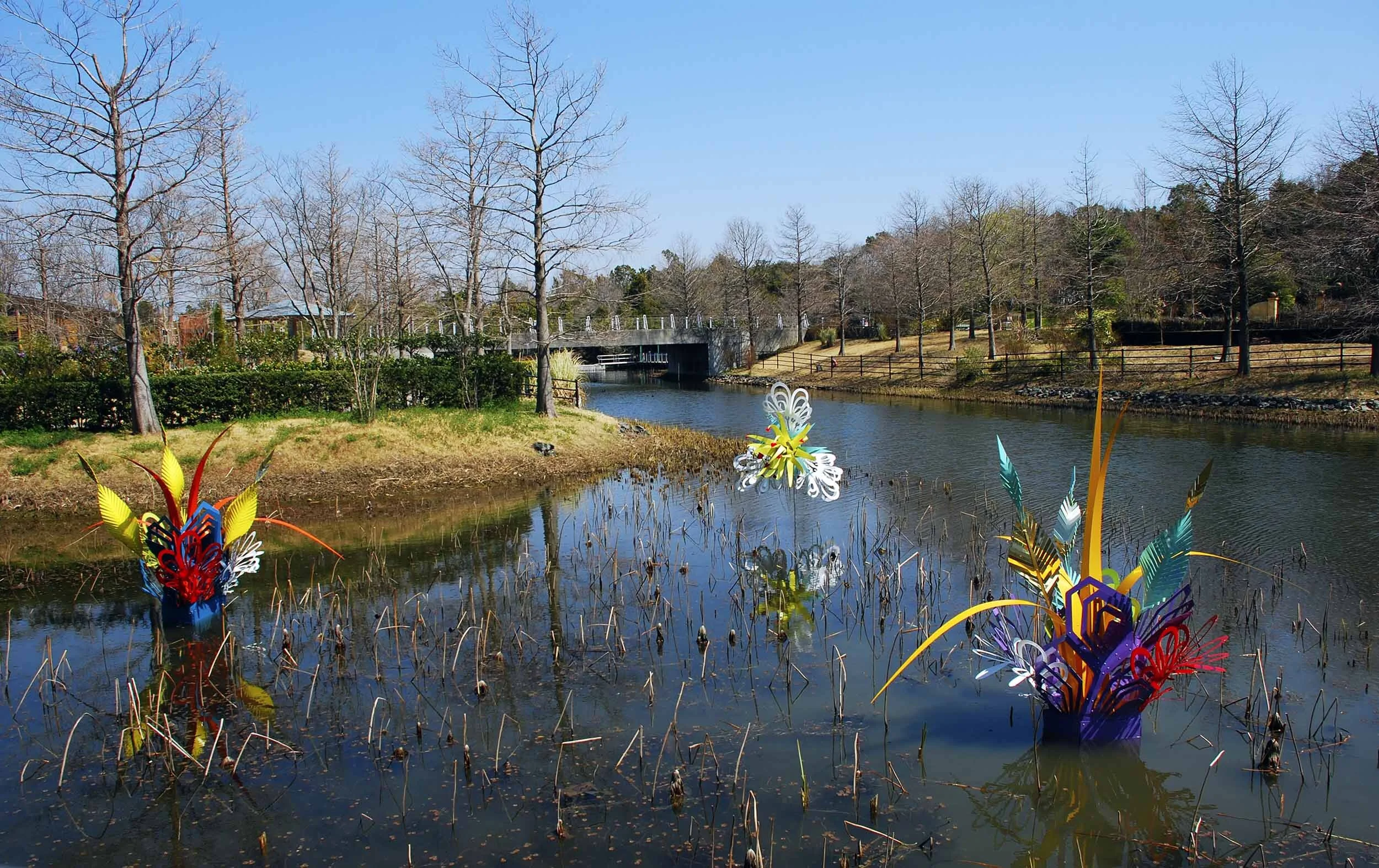colorful dynamic outdoor lake art installation flower exposition public sculpture water Japan