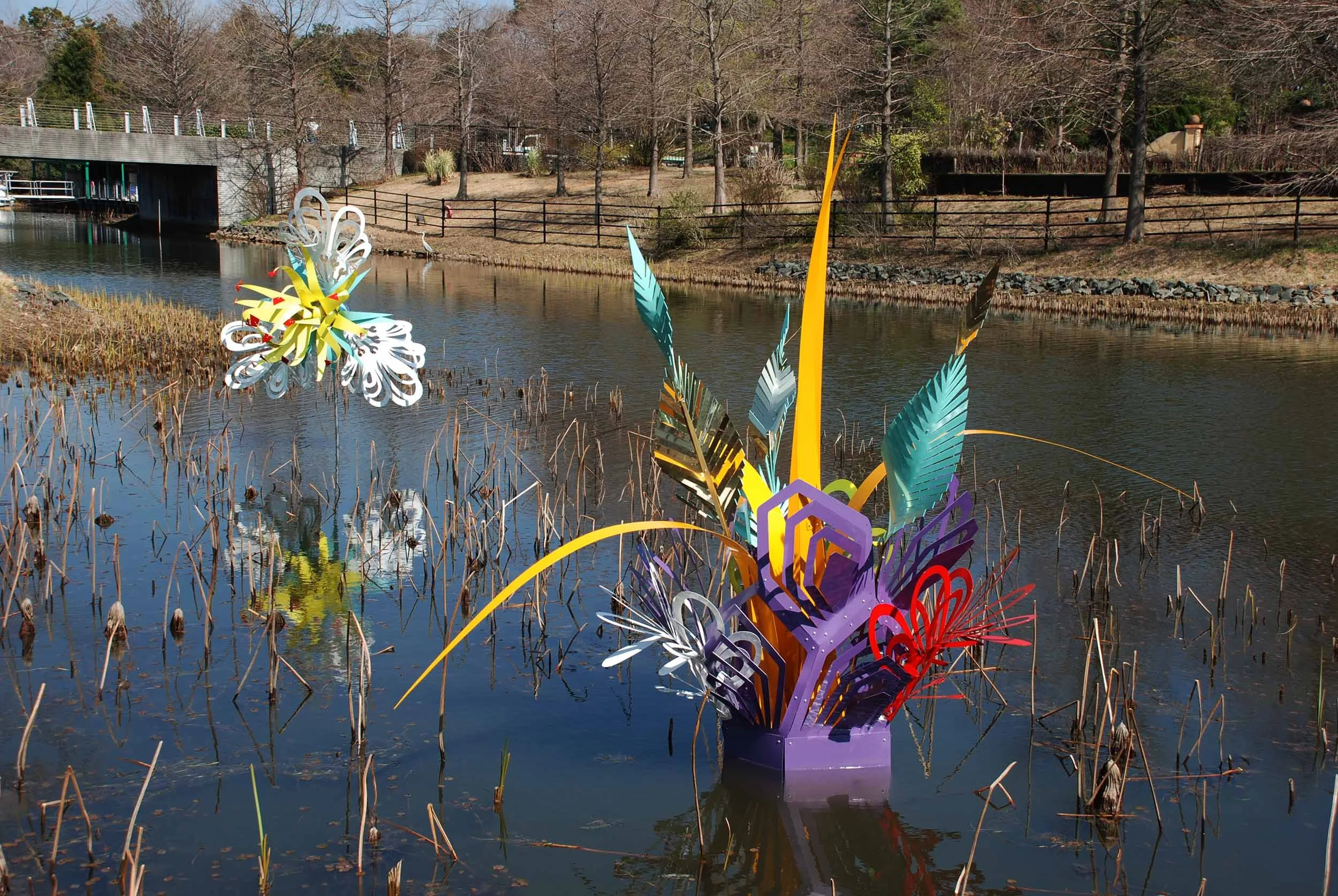 colorful dynamic outdoor lake art installation flower exposition public sculpture water Japan