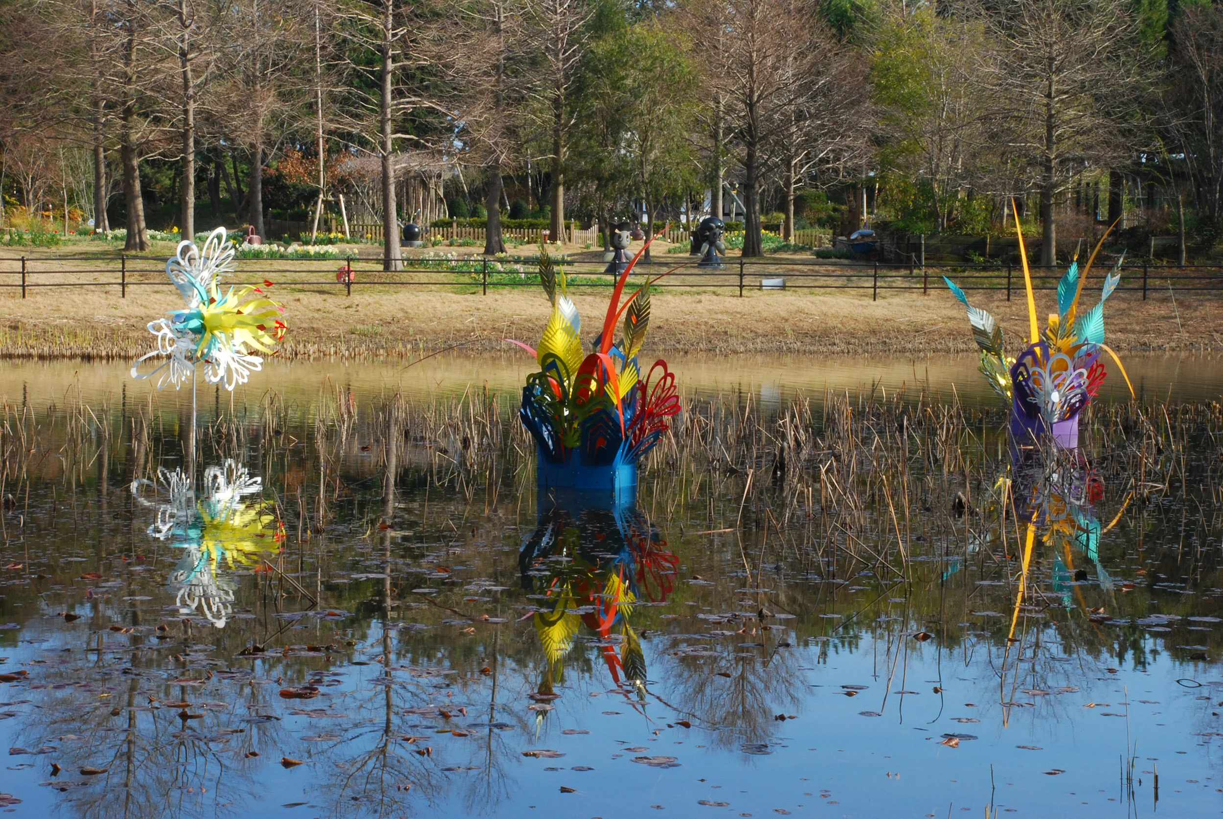 colorful dynamic outdoor lake art installation flower exposition public sculpture water Japan
