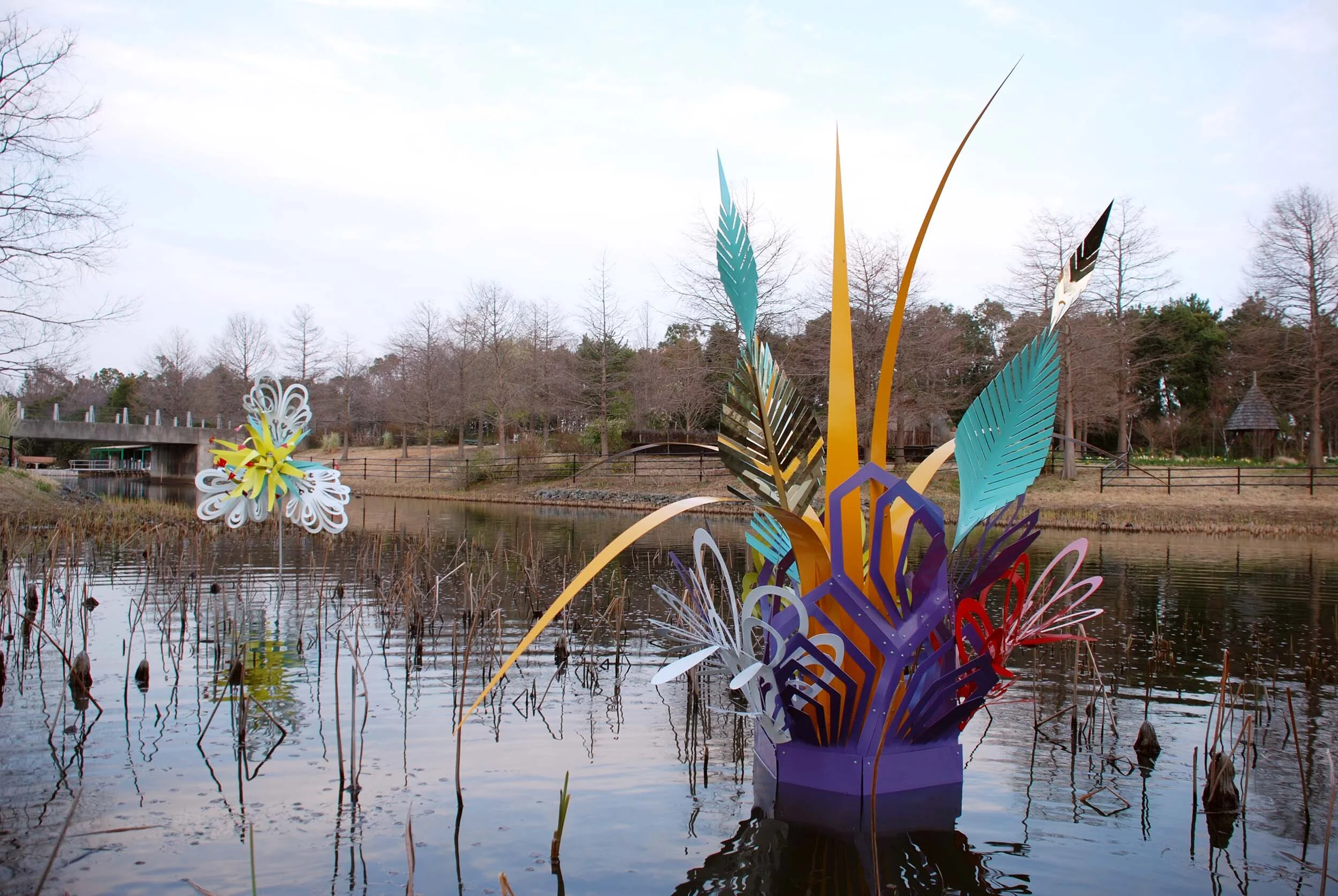 colorful dynamic outdoor lake art installation flower exposition public sculpture water Japan