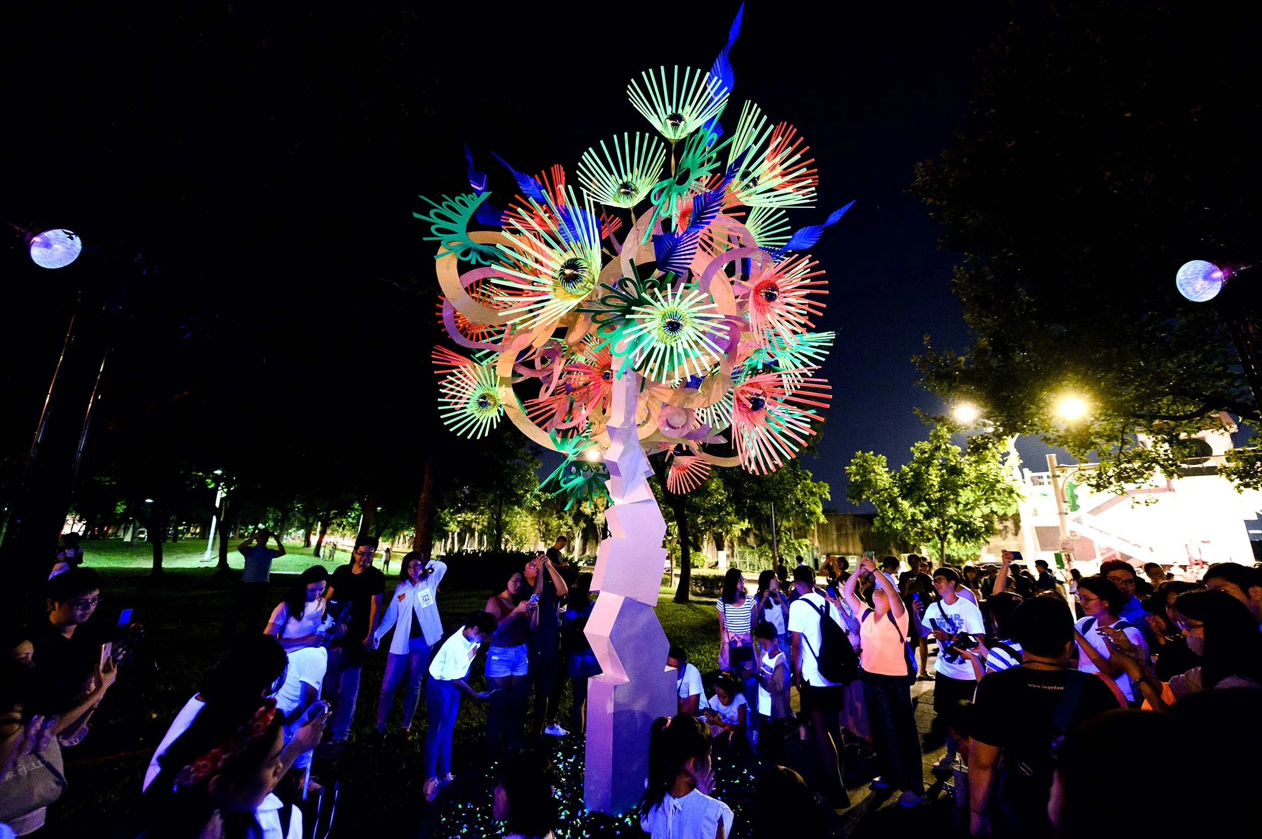 fluorescent bright urban light art tree installation sculpture park garden nuit blanche