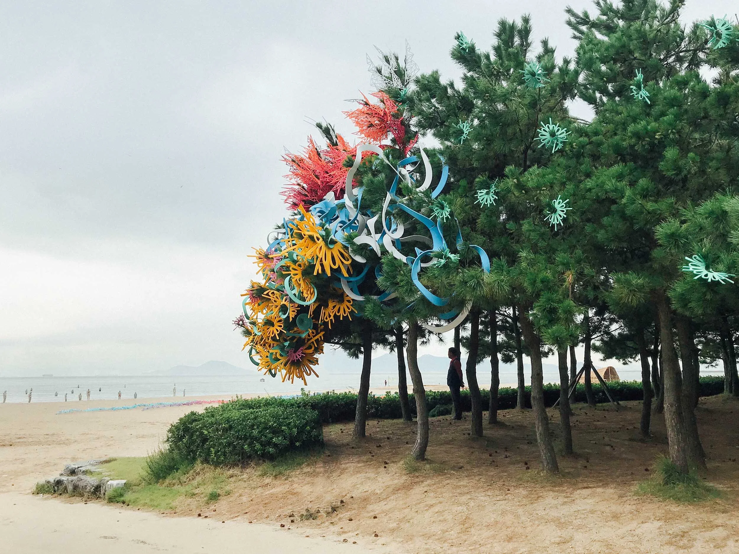 pair outdoor Busan Biennale public art commission beach colorful sculpture installation festival