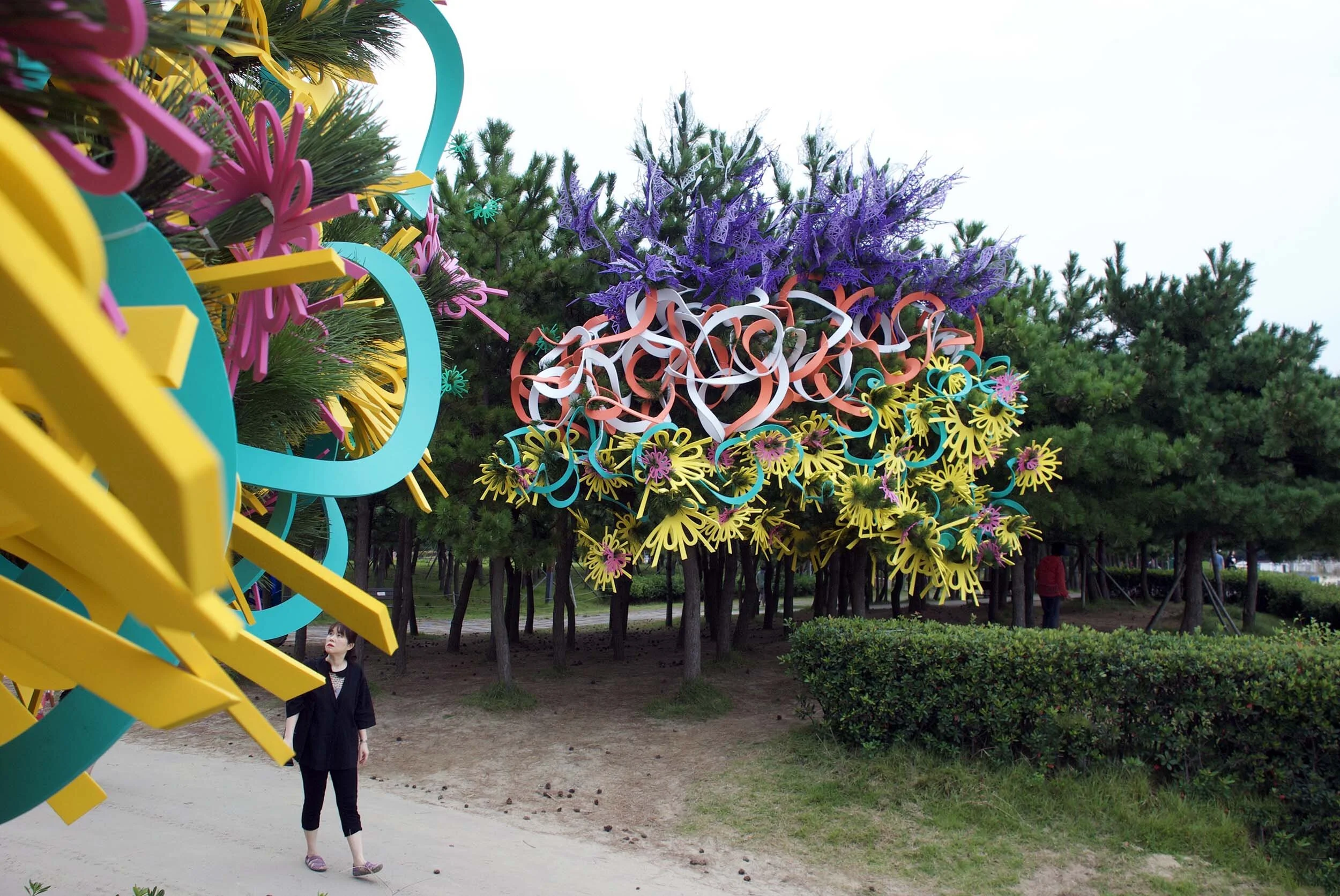 pair outdoor Busan Biennale public art commission beach colorful sculpture installation festival