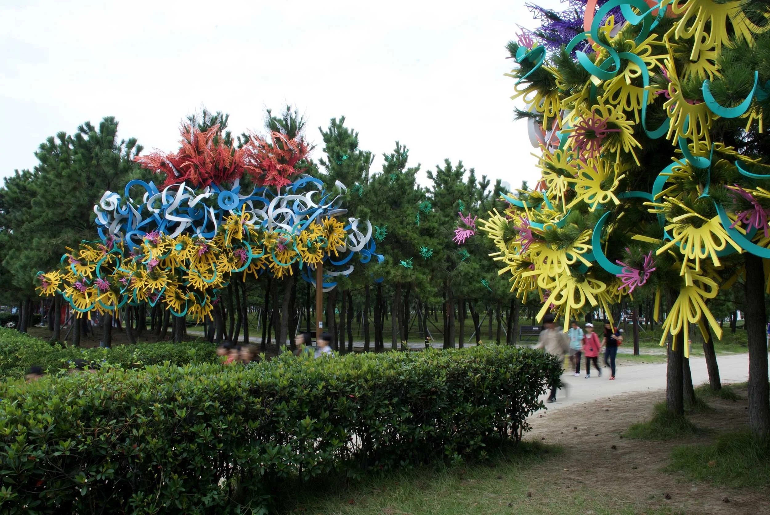 pair outdoor Busan Biennale public art commission beach colorful sculpture installation festival
