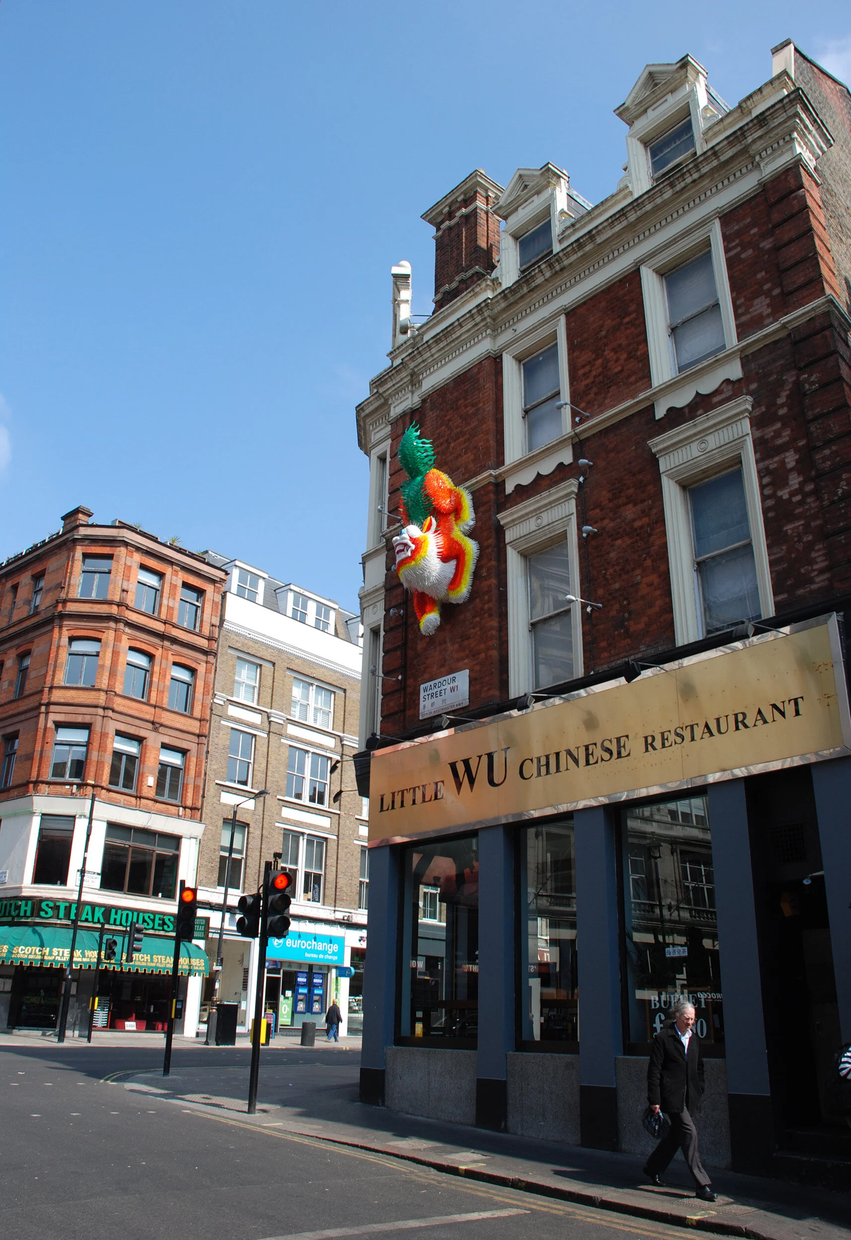 Chinese lion dragon bright colorful animal landmark public art sculpture London Chinatown