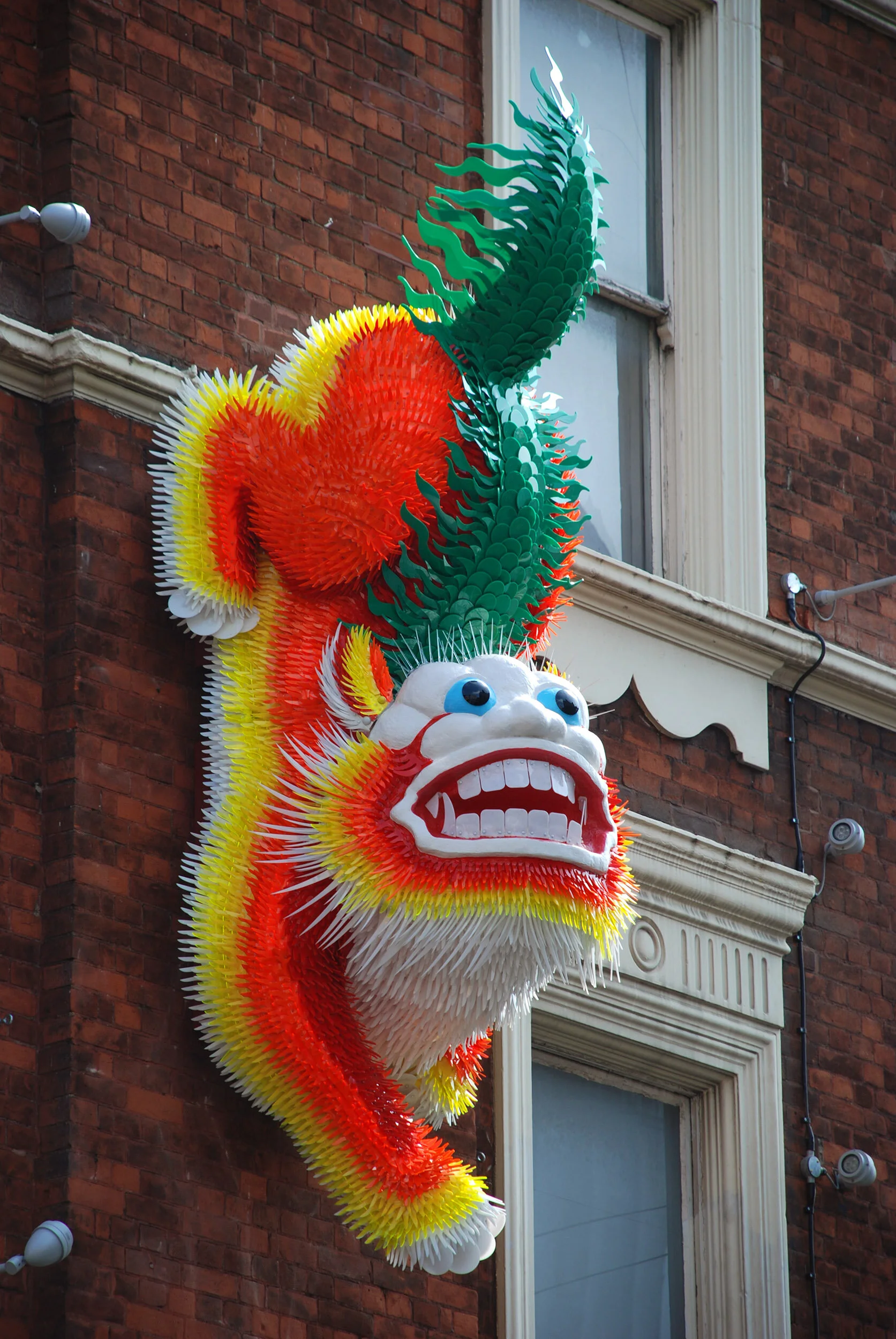 Chinese lion dragon bright colorful animal landmark public art sculpture London Chinatown