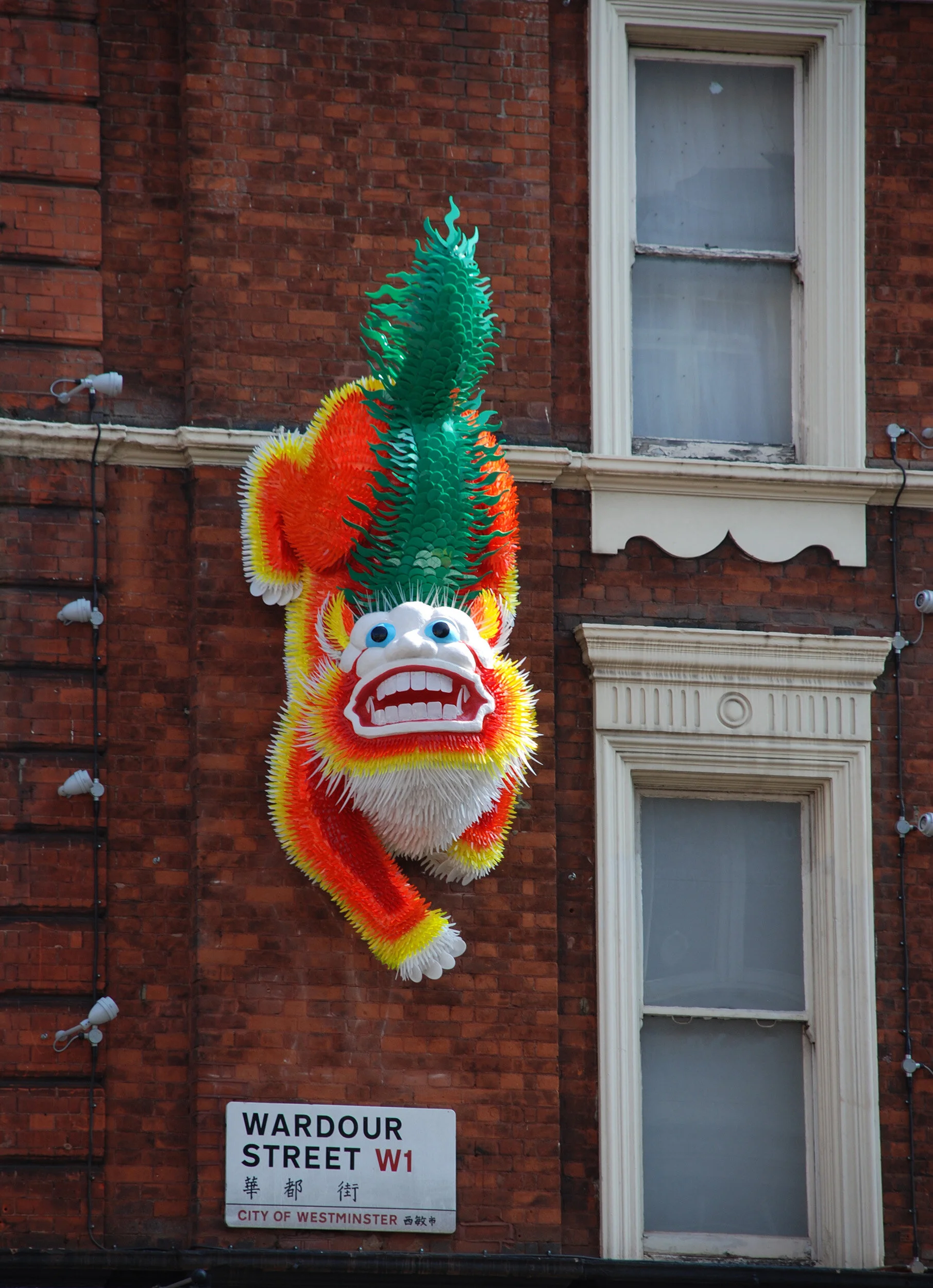 Chinese lion dragon bright colorful animal landmark public art sculpture London Chinatown