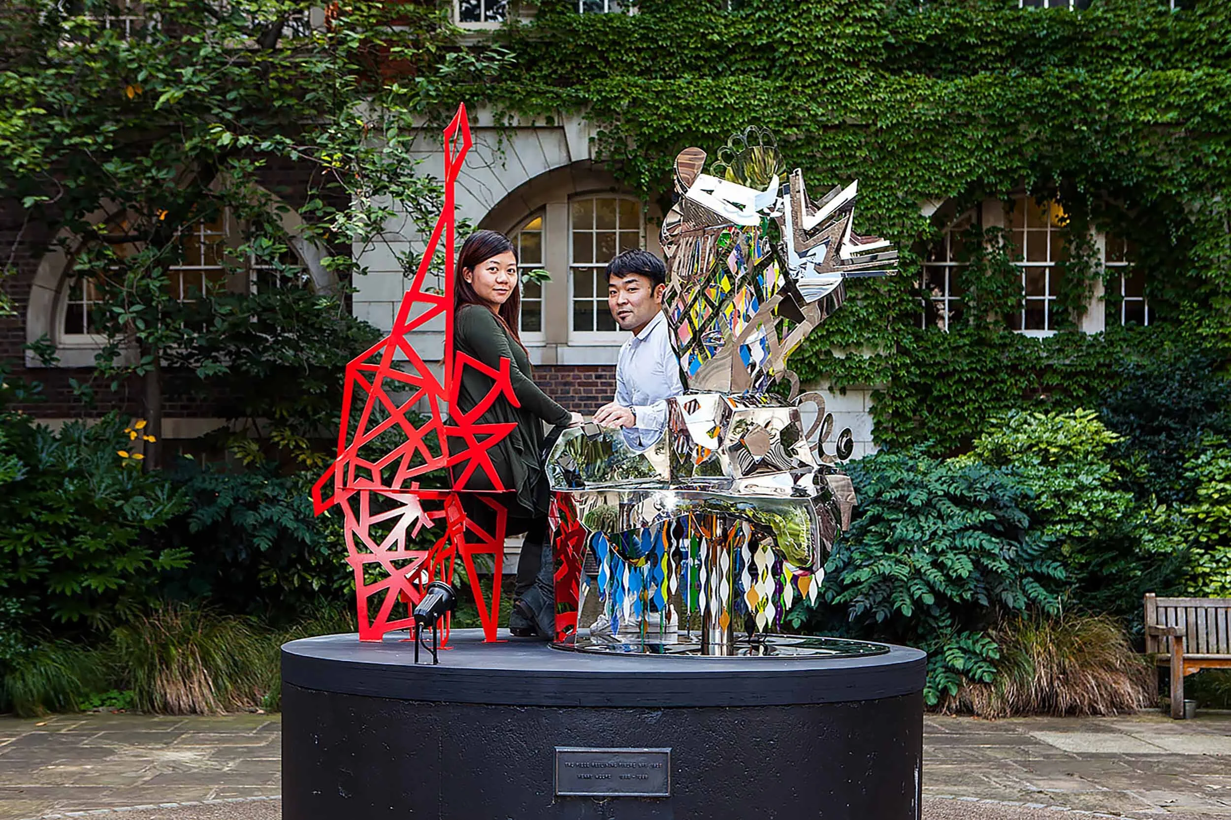 abstract figure polished stainless sculpture chair Henry Moore plinth art project Chelsea