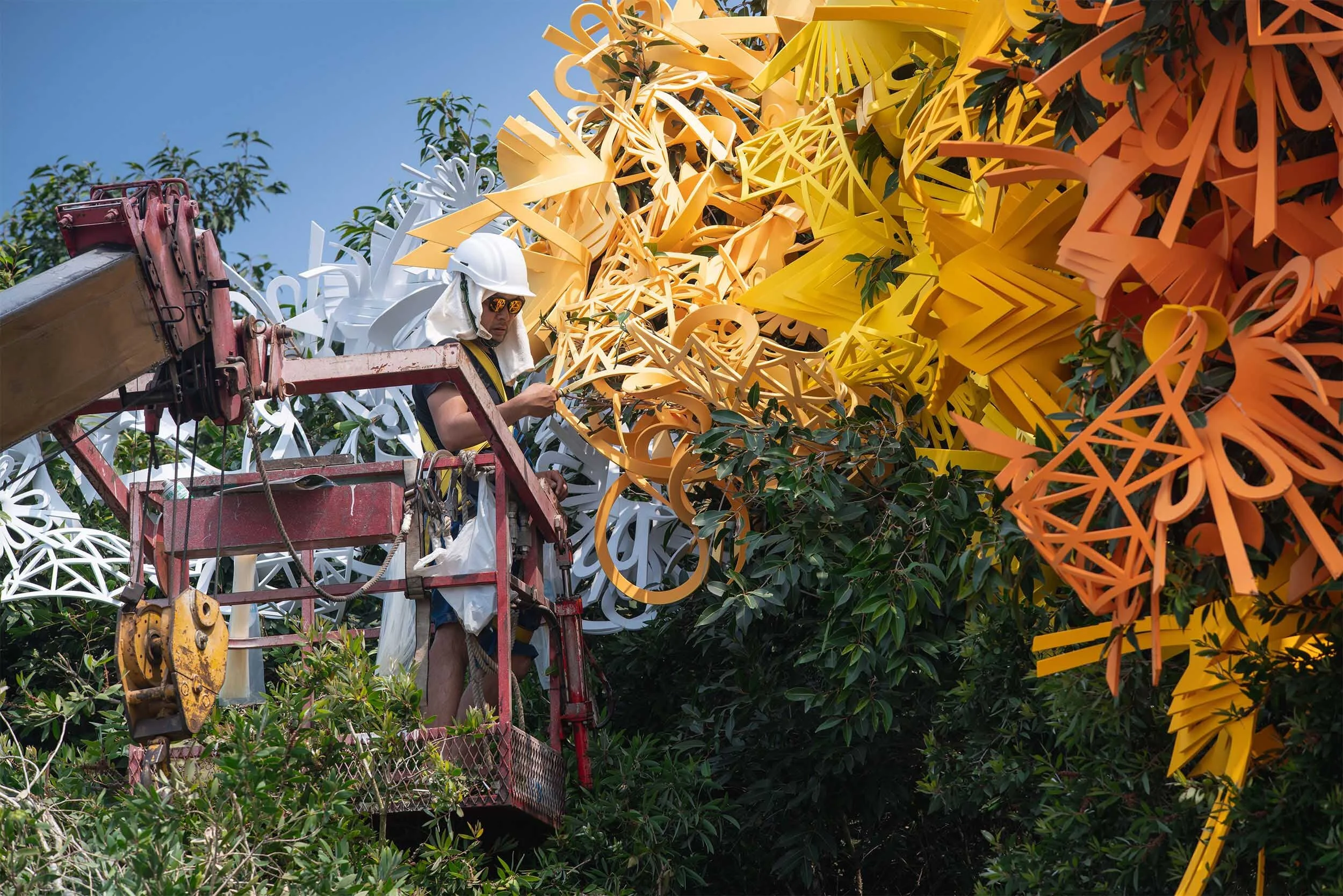 dynamic colorful bold outdoor art installation tree sculpture public beach Yuguang Island Festival Tainan Taiwan