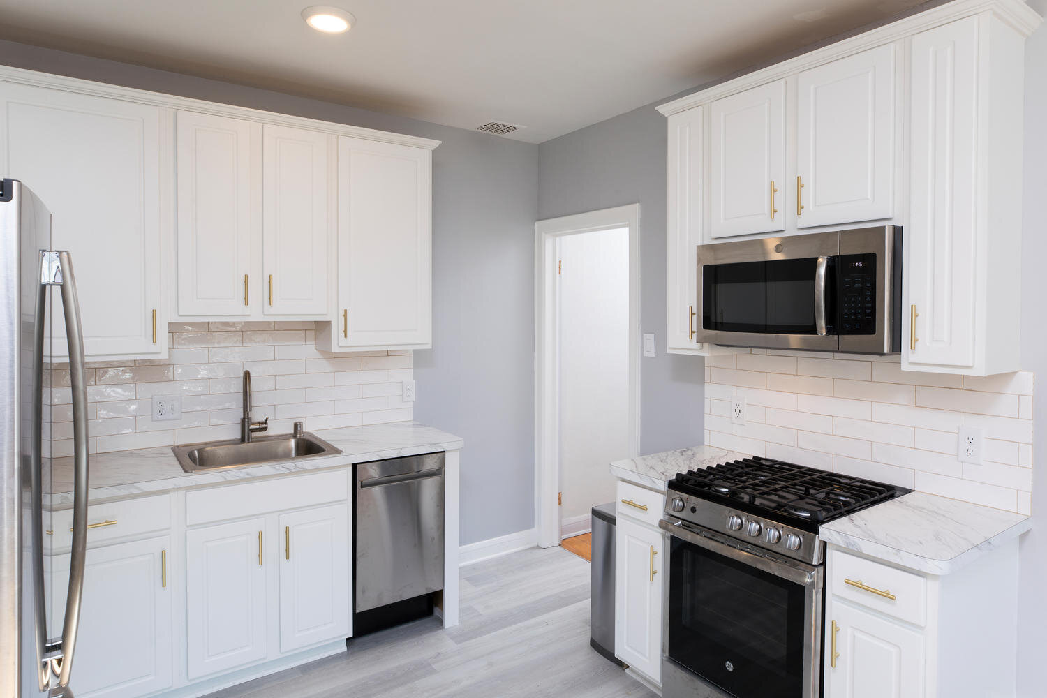 White Kitchen Cabinets with new Backsplash