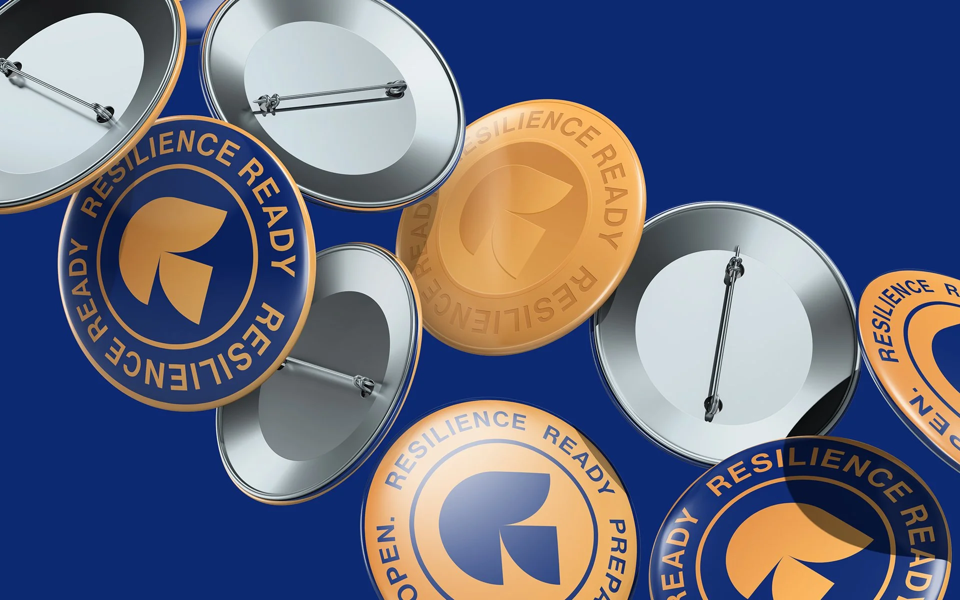 Goldenseal branded pins featuring logo and “Resilience Ready” message in blue and gold design