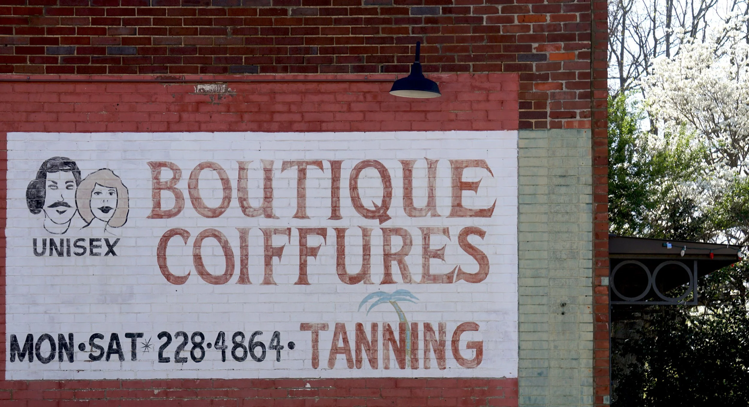  A mural on the side of the building of James Beard Award nominated East Nashville restaurant, Lockeland Table. In a previous life, the building was a beauty salon. The name of that salon, “Boutique Coiffures,” appears on this mural, next to some cru