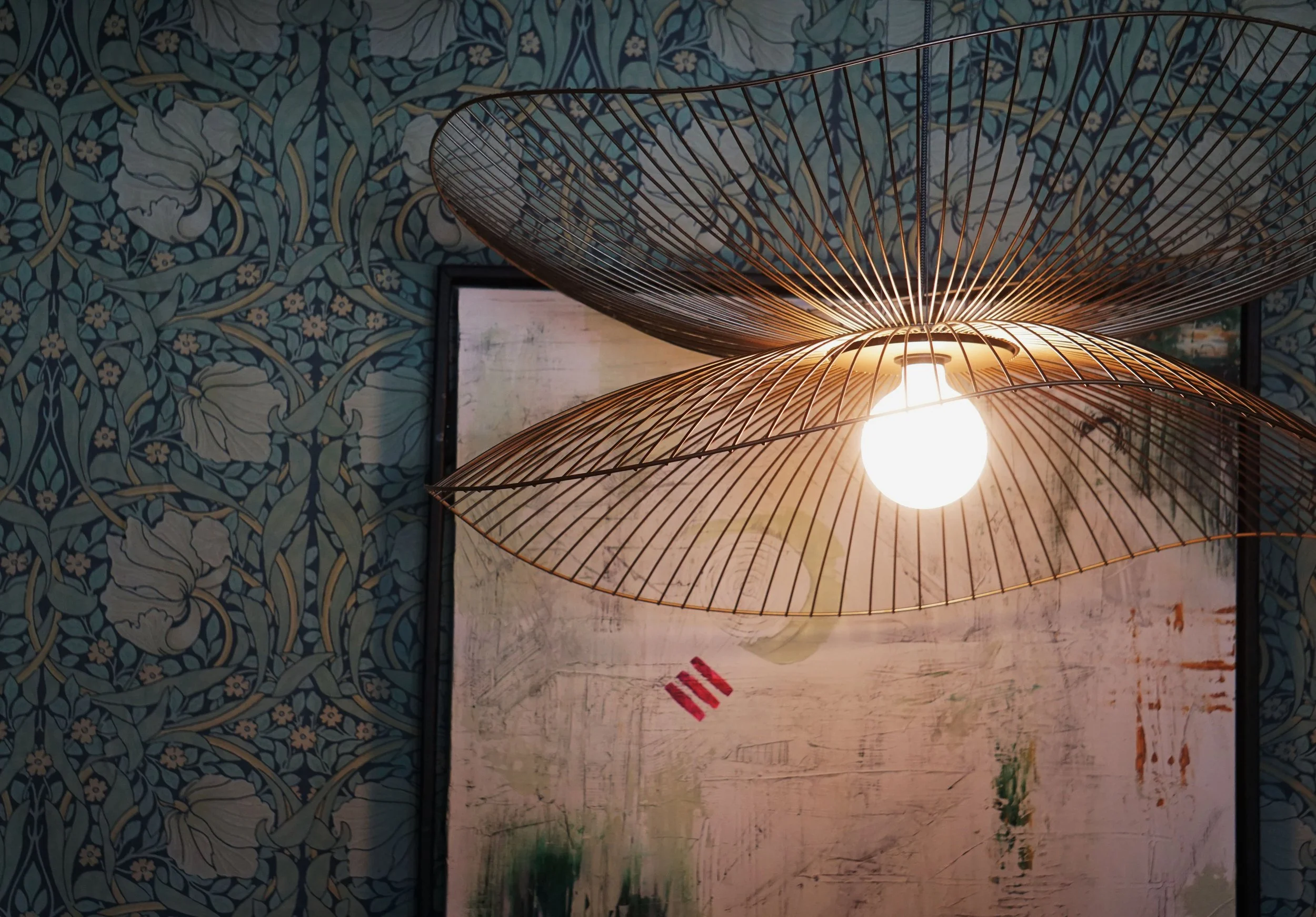  A light fixture, a piece of art, and some quirky wallpaper that help set the scene for what you can expect inside James Beard Award nominated East Nashville restaurant, Lockeland Table. 