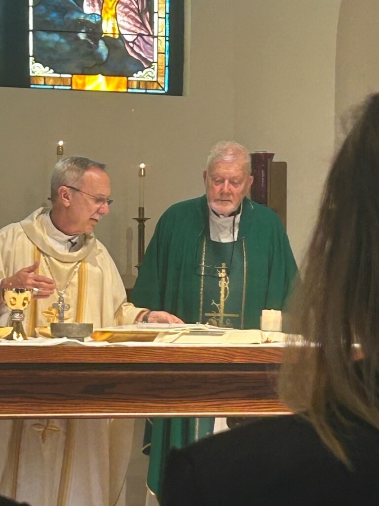 Bishop and Fr. Fred behind altar.jpg
