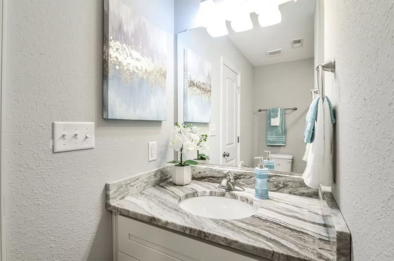 View of hall bathroom looking at single vanity 