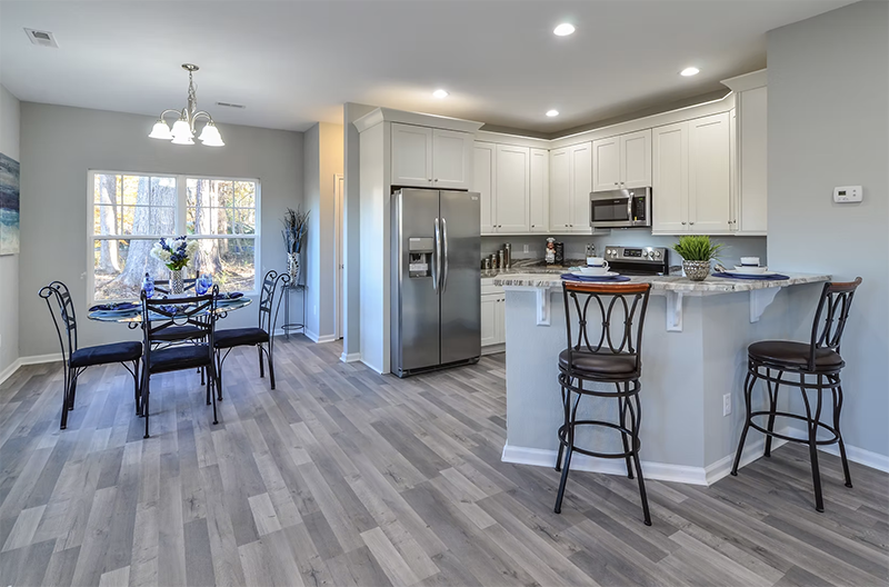 View of kitchen and dining space from living space