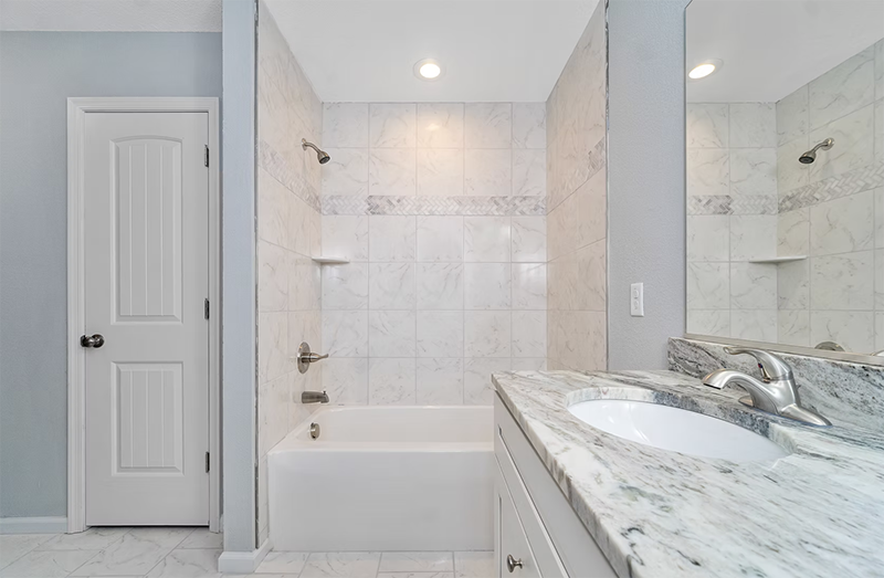Bathroom view looking at sink and shower