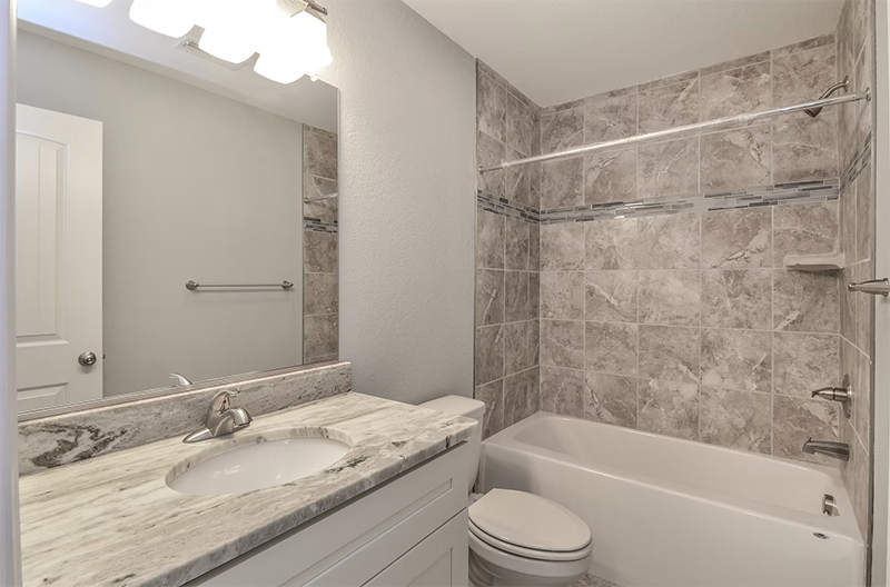 Bathroom view looking at single vanity and shower