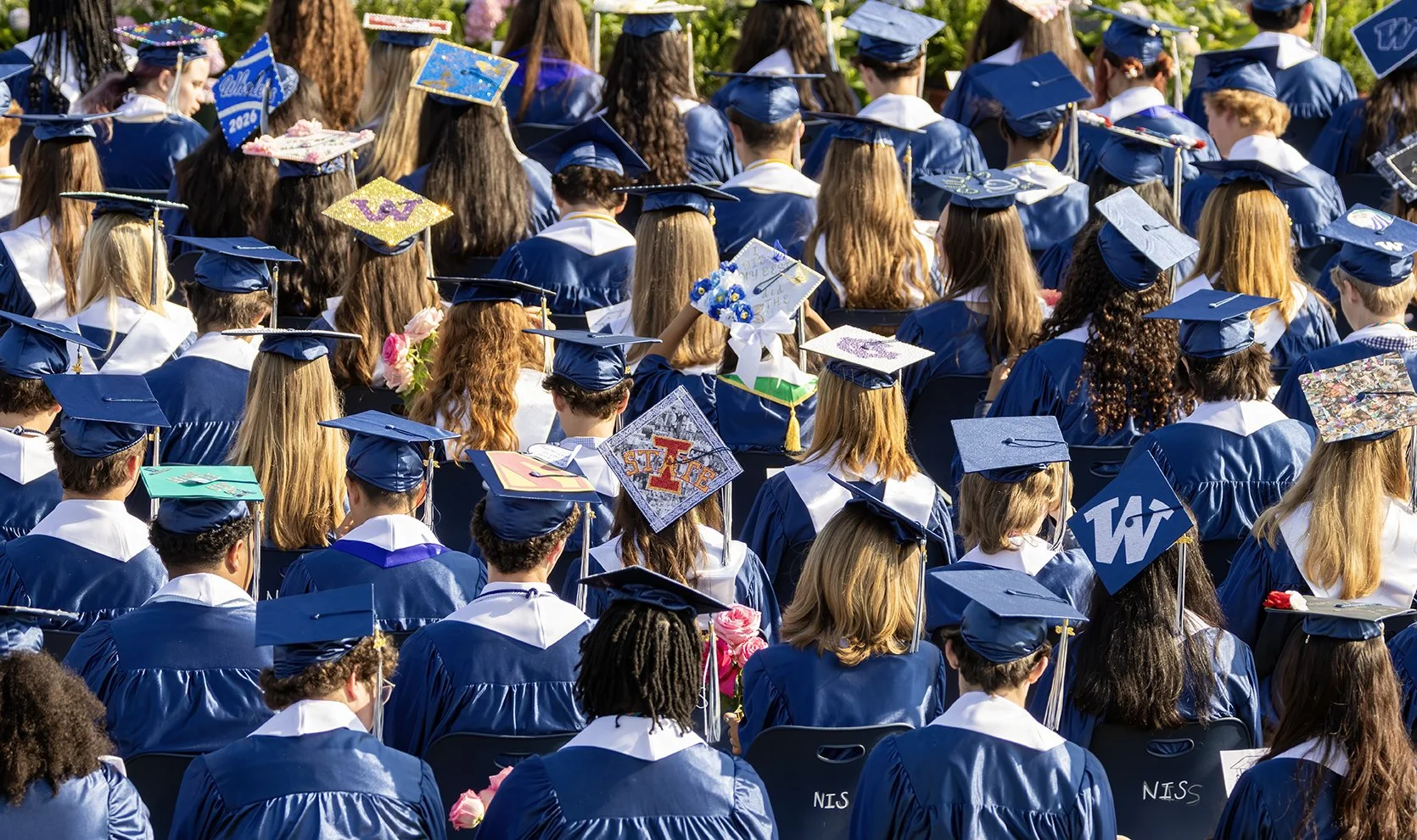 New grads toss their hats