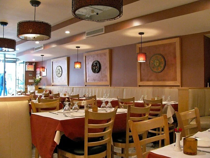 Tamba's interior: warm colors; comfortable booth, banquette, or traditional table & chair seating; bright and cheerful space