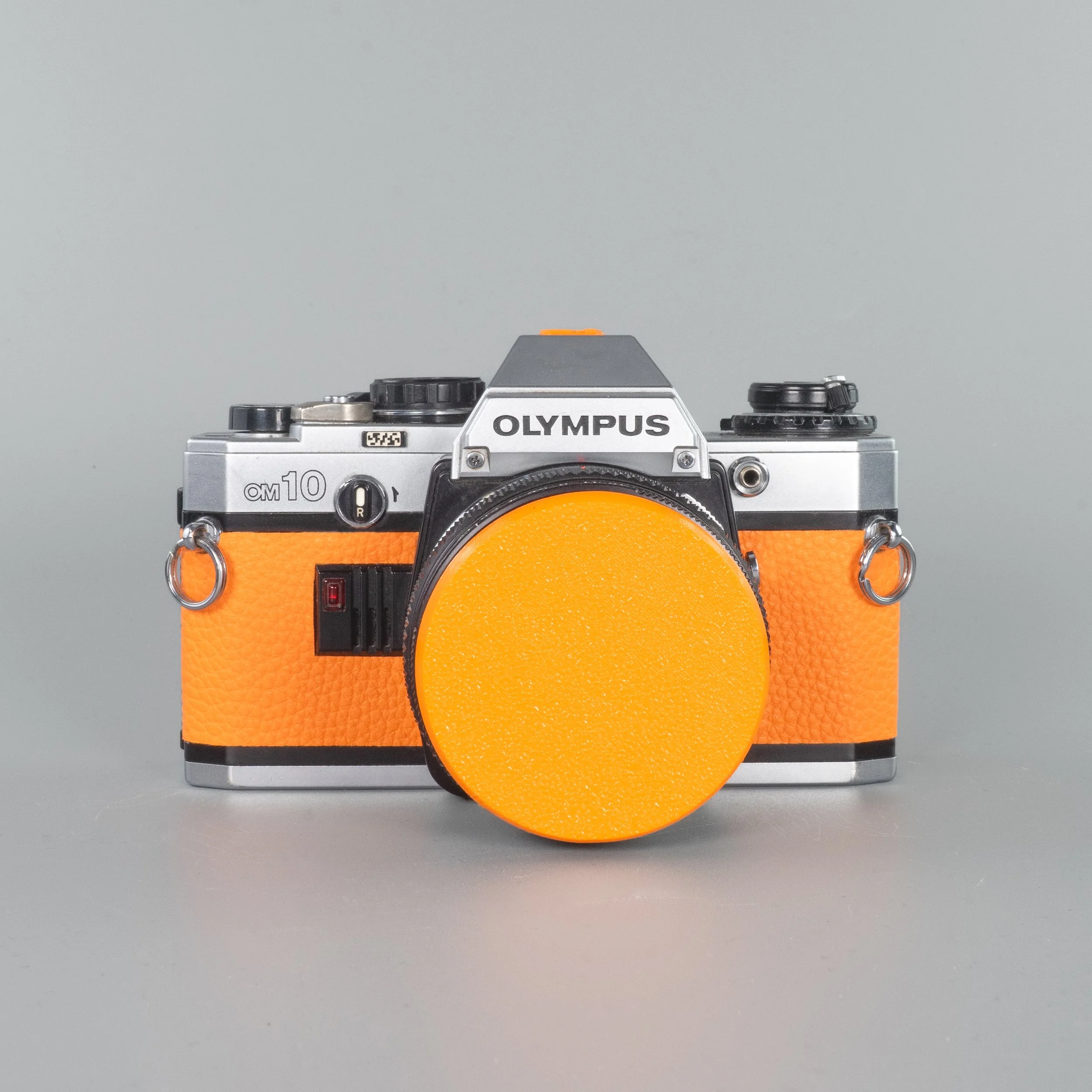 Olympus OM10 (Tangerine) - Refurbished 35mm SLR Film Camera — LensFayre