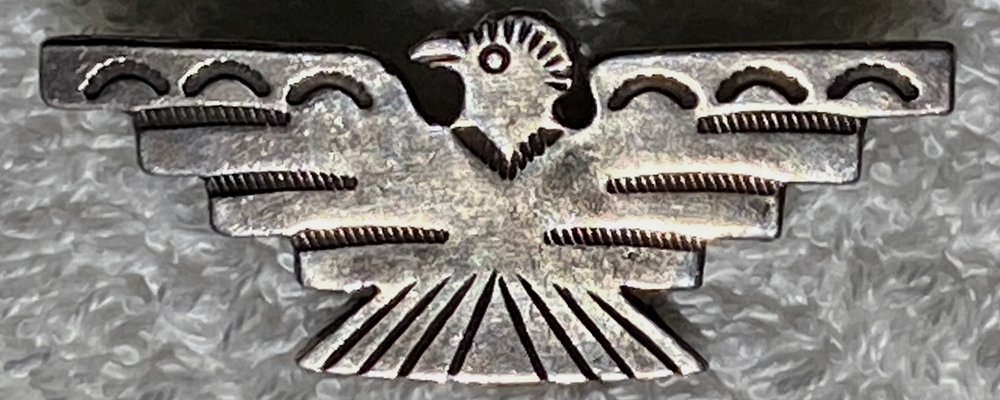 Fred Harvey era vintage Navajo Silver pin in a thunderbird shape