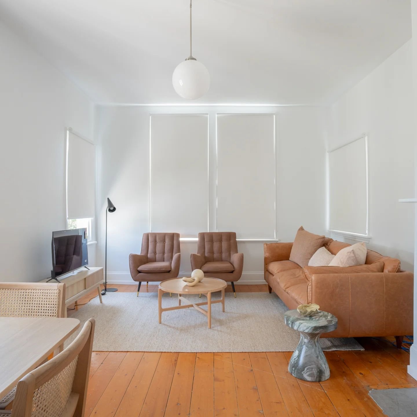 Another property styled by Evoke Property Styling 

Here is the living room in Welman Street, I made the tan leather sofa from @freedom_australia the hero piece and added colour and texture to the space. I've also continued using natural fibres such 