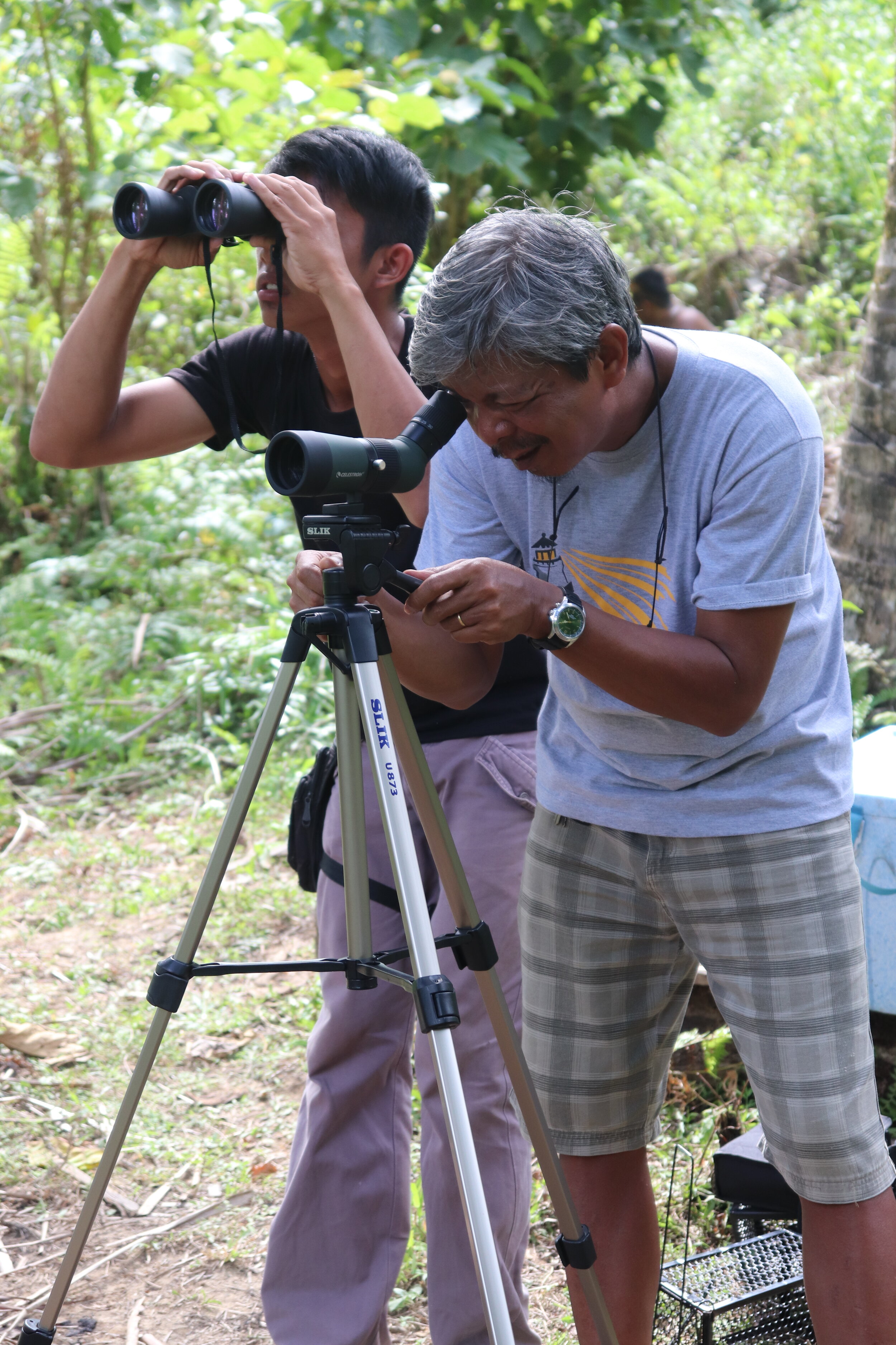 C.2 Participants of the Participatory Forest Resource Inventory learn how to use telescopes for bird surveys.JPG