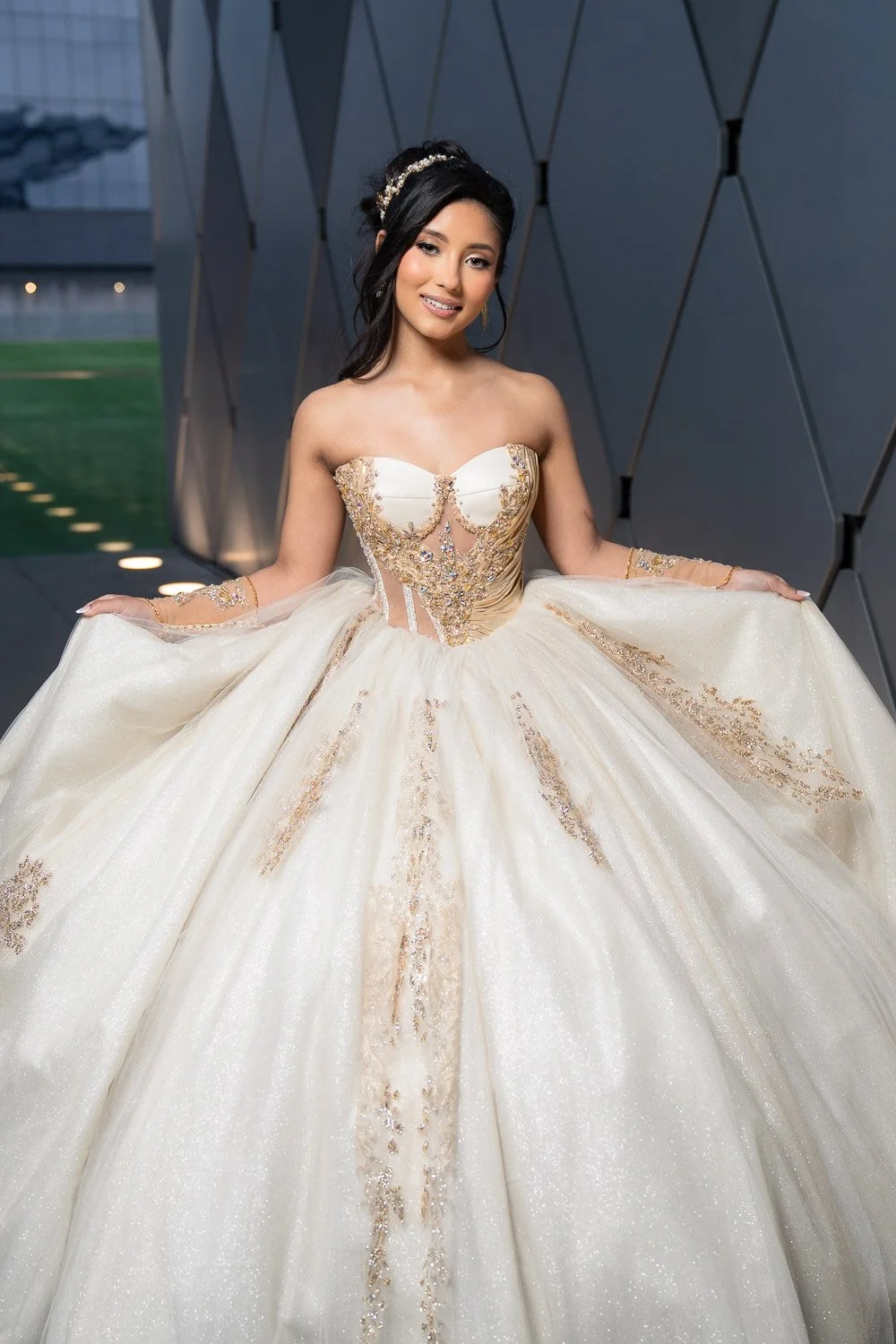 Elegance in every detail — Isabella shines effortlessly, her quinceañera gown creating a perfect contrast against the contemporary design of the Winspear Opera House.