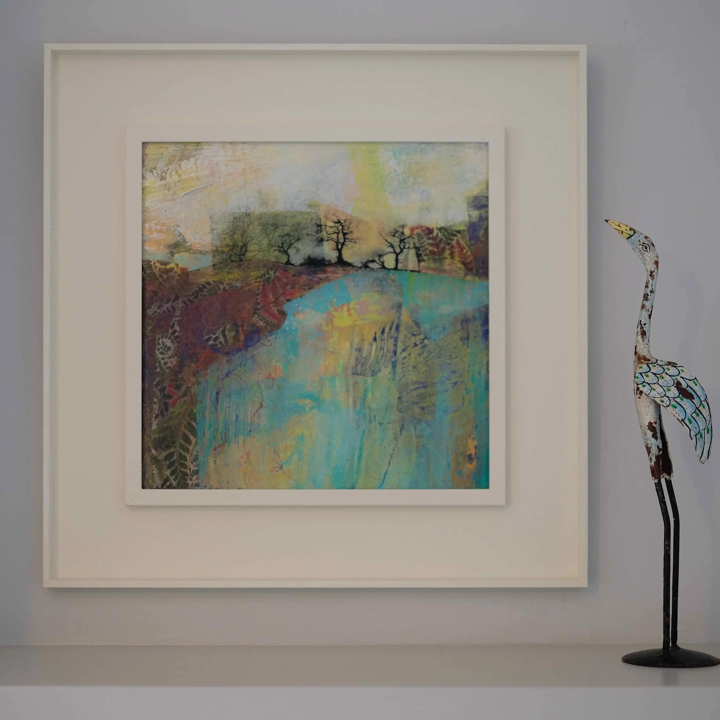 Framed painting by Dorking artist Joanne Olney of a colourful landscape with trees on the horizon