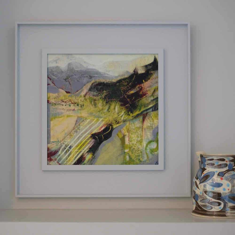 Framed painting by Dorking artist Joanne Olney of a mountainous and patterned landscape