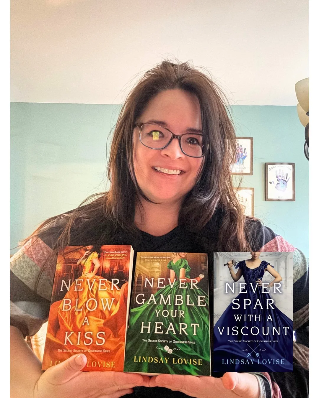 Look at these books together! They&rsquo;re so beautiful I have a sparkle in my eye. (No, it&rsquo;s not the reflection of my phone in my glasses. And I did NOT edit in the third book because I technically don&rsquo;t have it yet). **It is all of the