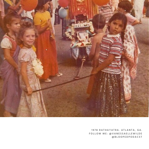 Children at a fair or carnival, with some holding balloons and others standing near a game or stall.