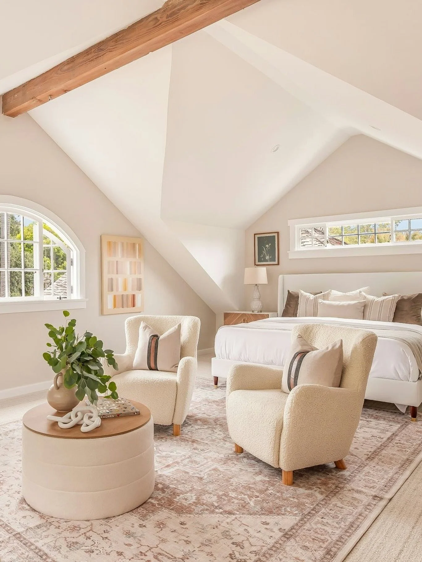 The upstairs primary suite at Georgina is a private retreat with vaulted ceilings, a sunlit office, and space to unwind.