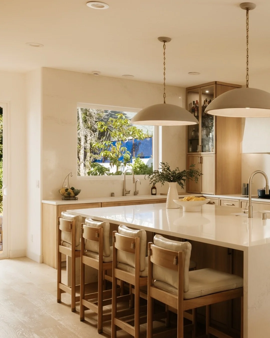 The kitchen at Sunset Park was designed to be both beautiful and deeply livable. Thoughtfully finished with custom details, elevated materials, and Miele and Thermador appliances, it effortlessly anchors the home while opening seamlessly to the surro