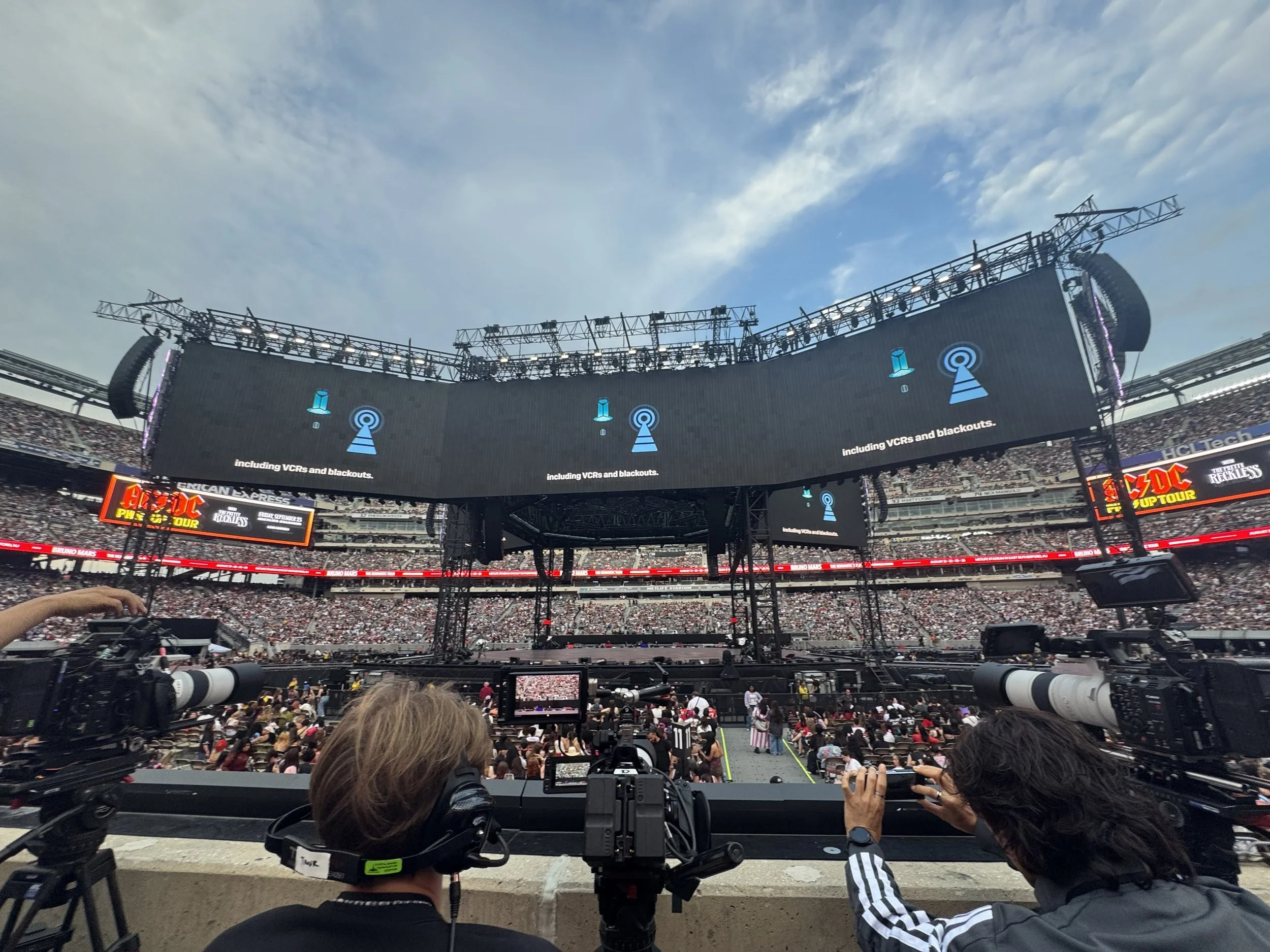 Stage and screens during a stadium concert video production at MetLife Stadium