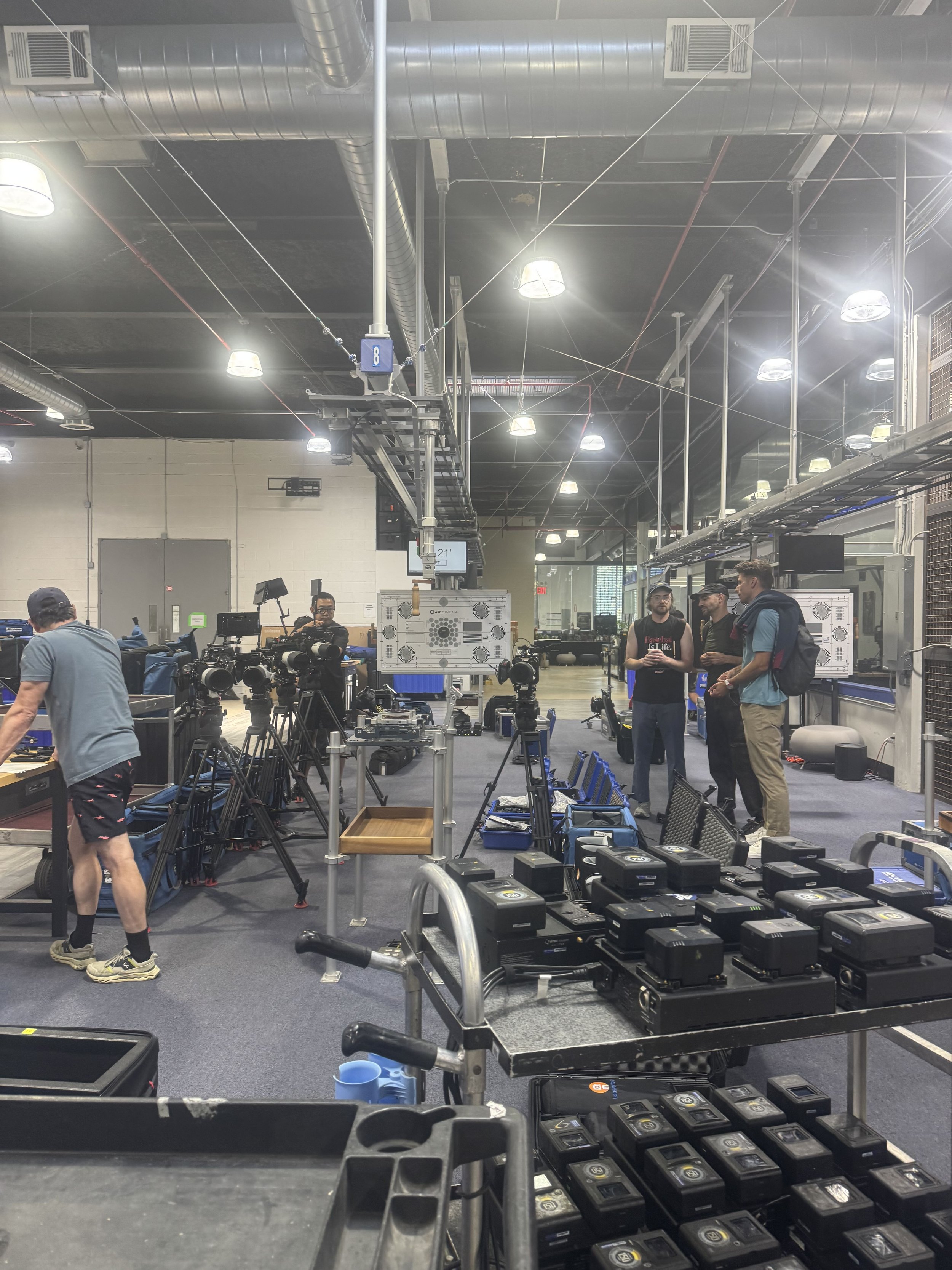Camera equipment prep at a New York rental house for a stadium concert shoot